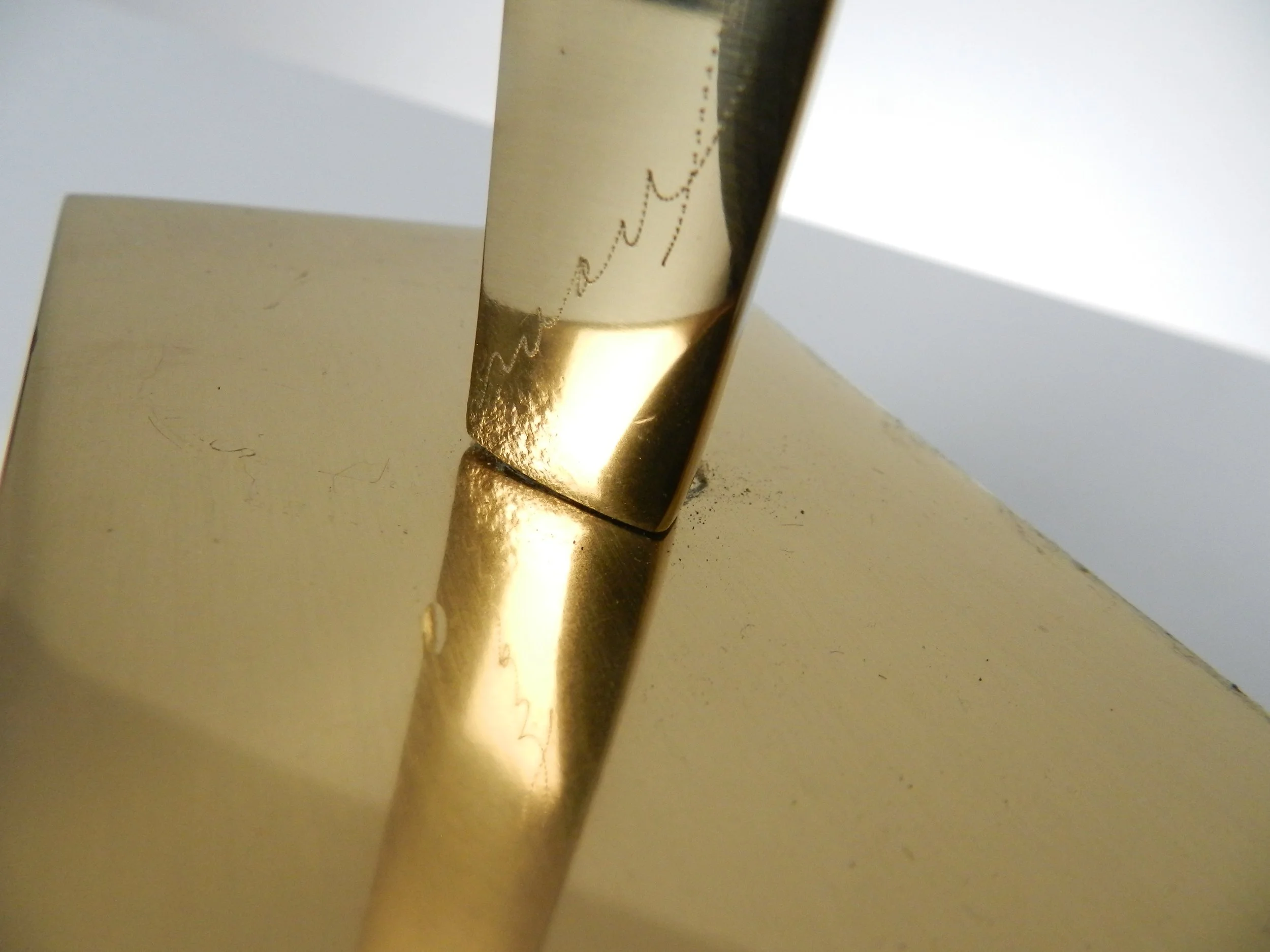 Abstract sculpture in polished bronze by May Marx. Signed on base and leg.  Canada, 1980s.