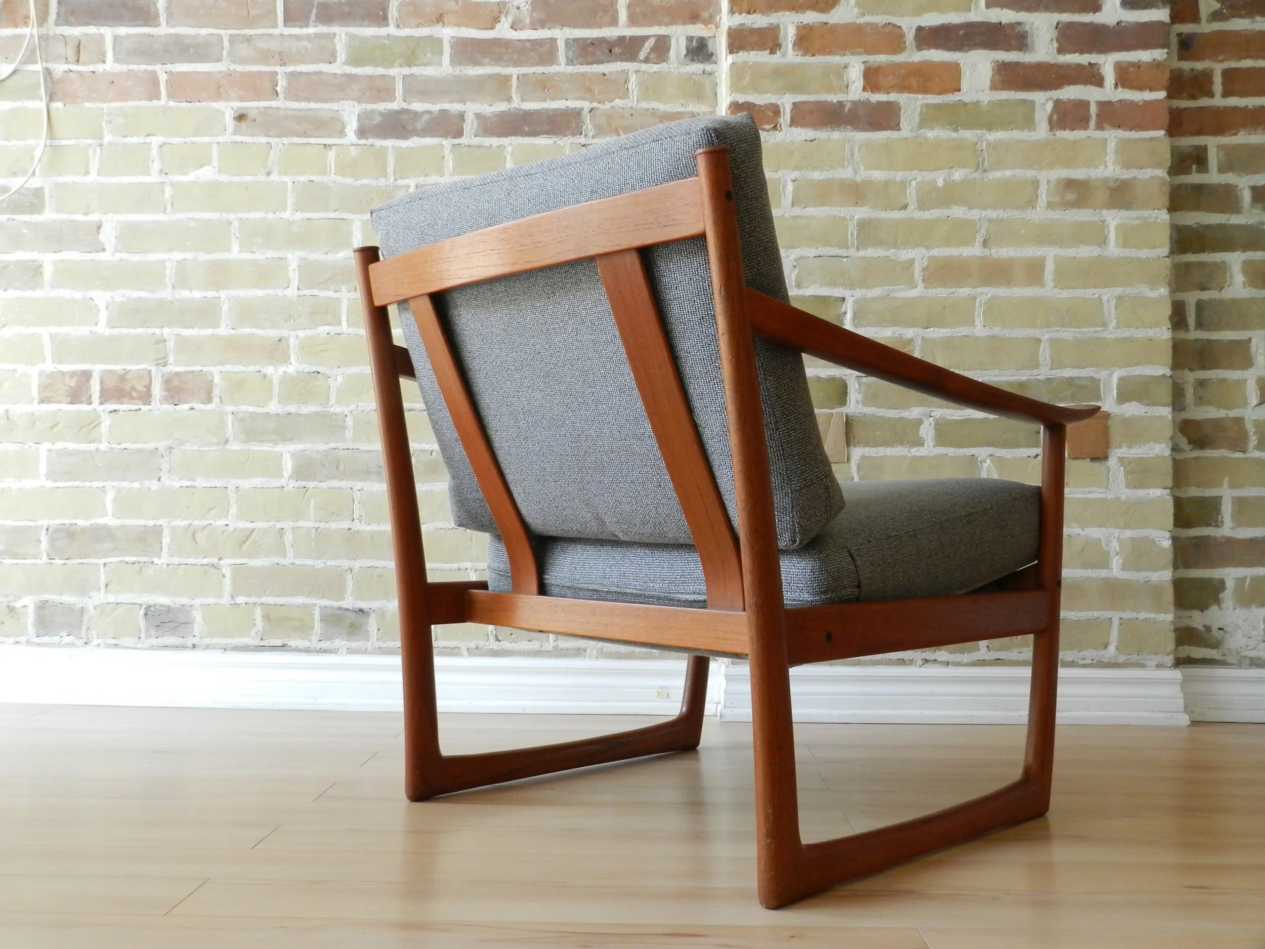Teak armchair and ottoman model FD-130 designed by Peter Hvidt and Orla Molgaard-Nielsen for France and Sons.  Denmark, 1960s.