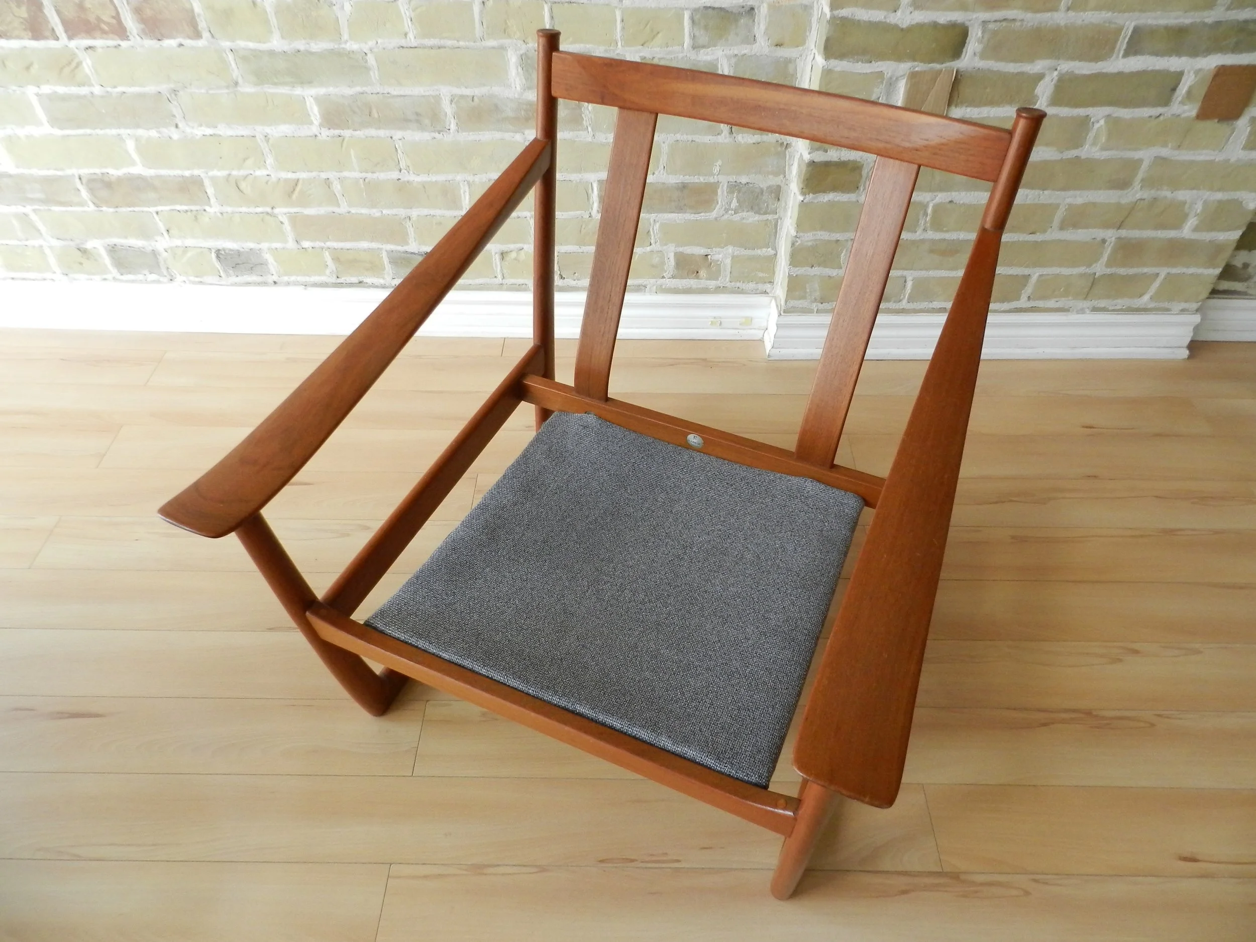 Teak armchair and ottoman model FD-130 designed by Peter Hvidt and Orla Molgaard-Nielsen for France and Sons.  Denmark, 1960s.