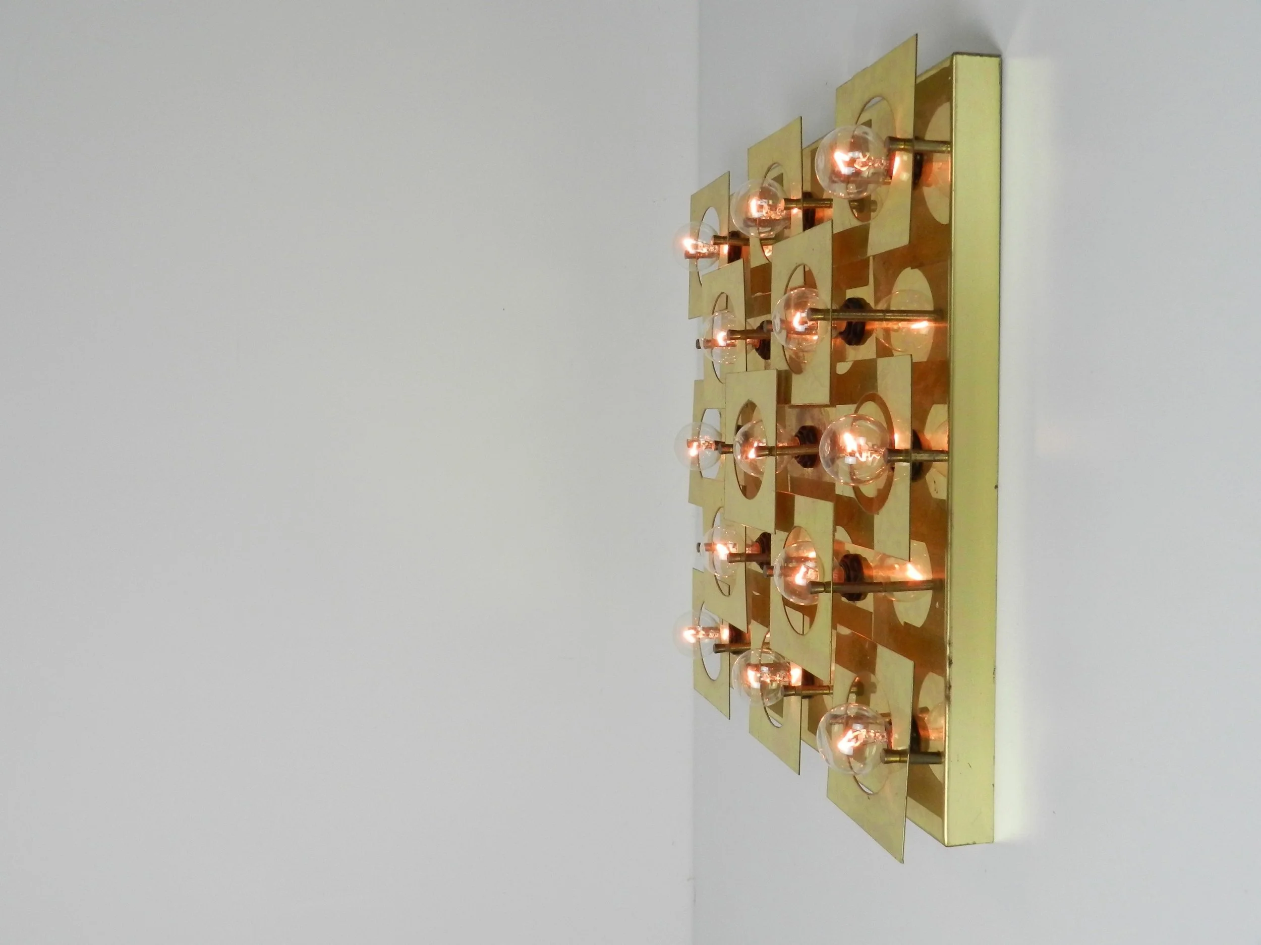 Modernist geometric wall or ceiling lamp in brass. Possibly by Lightolier.  circa 1980s.