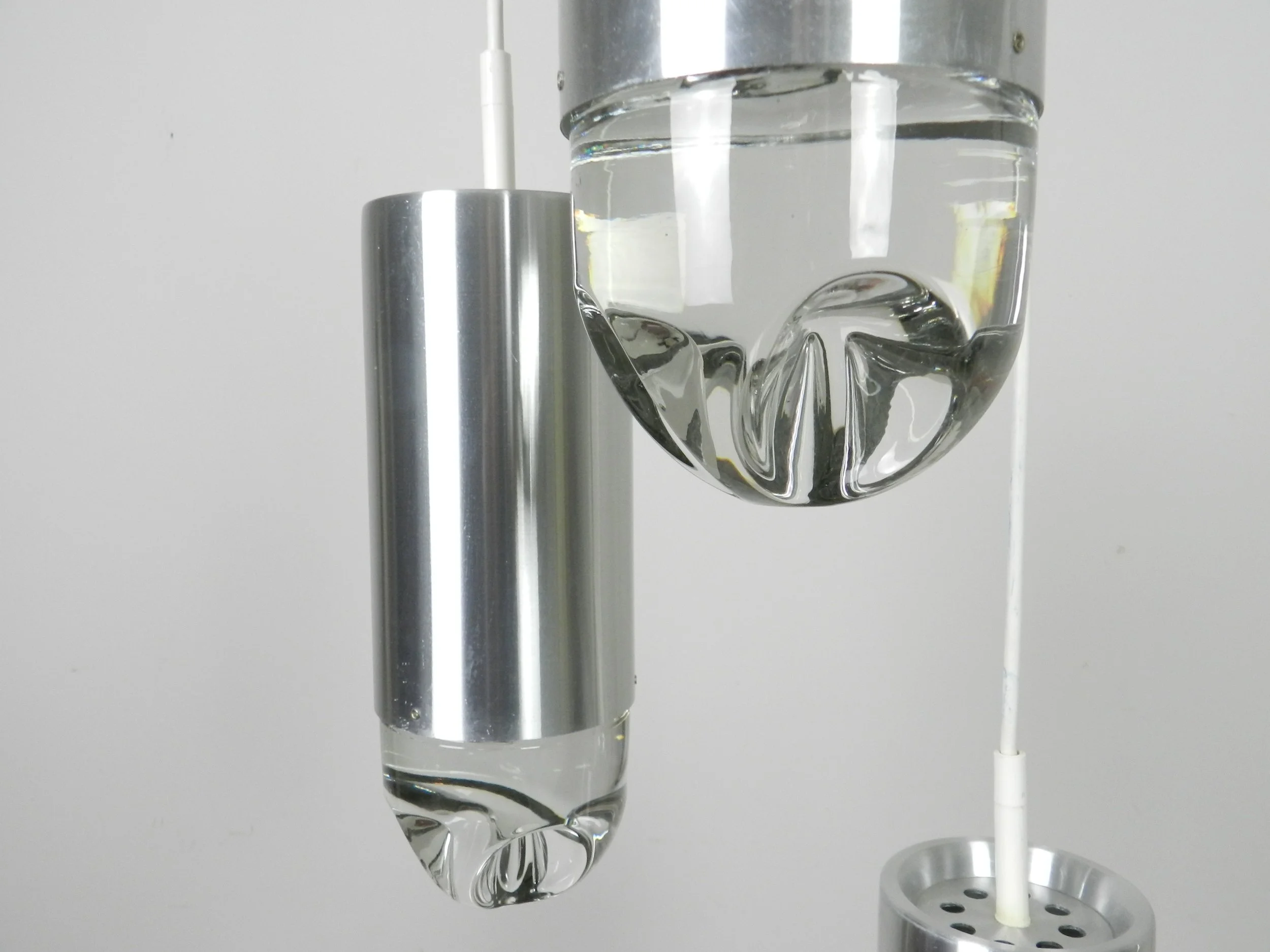 Cascade light fixture by Raak. Aluminum with heavy clear glass shades.  Netherlands, 1970s.