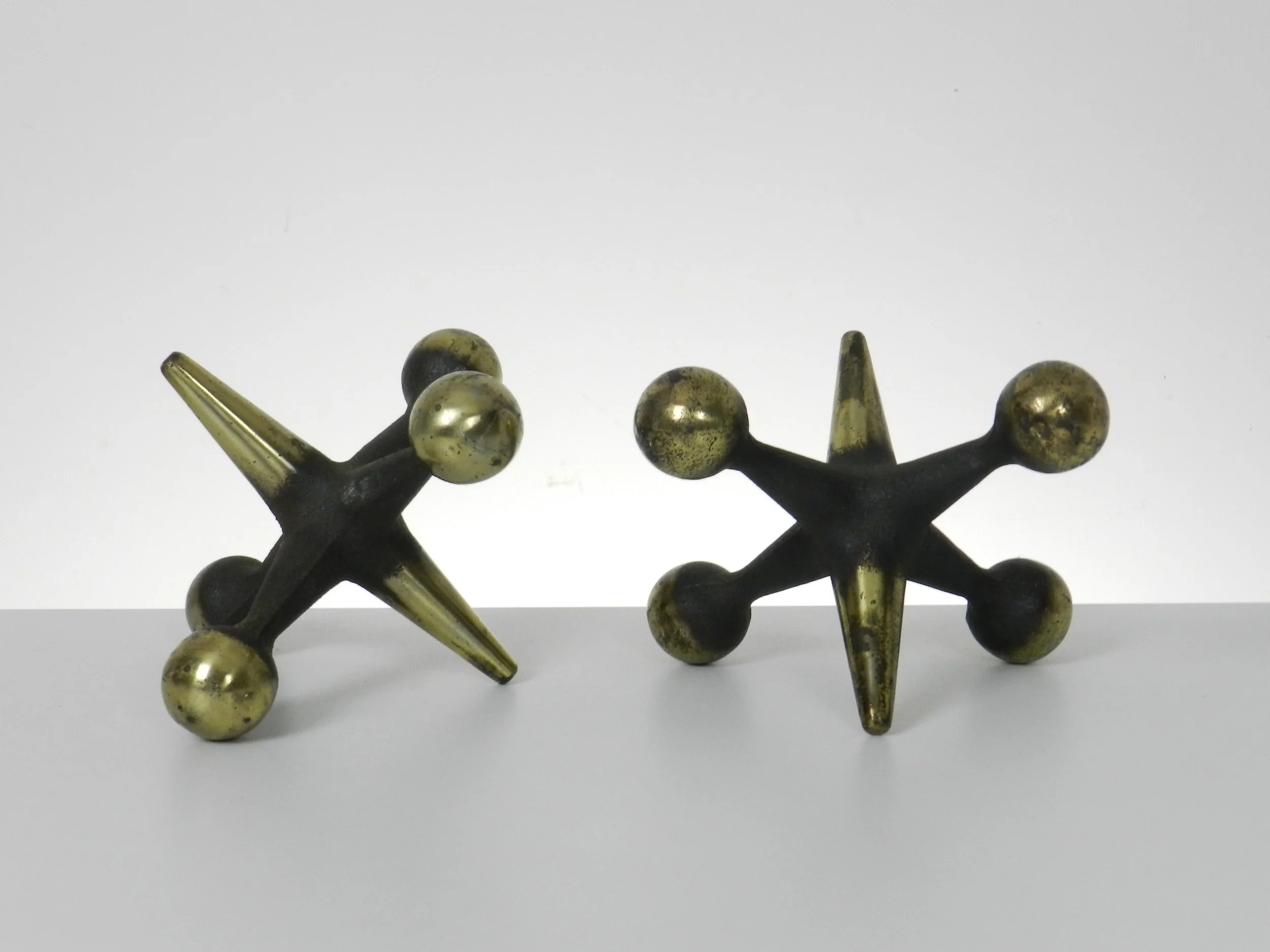 Pair of mid century cast iron bookends designed by Bill Curry for Design Line.  circa 1960s.