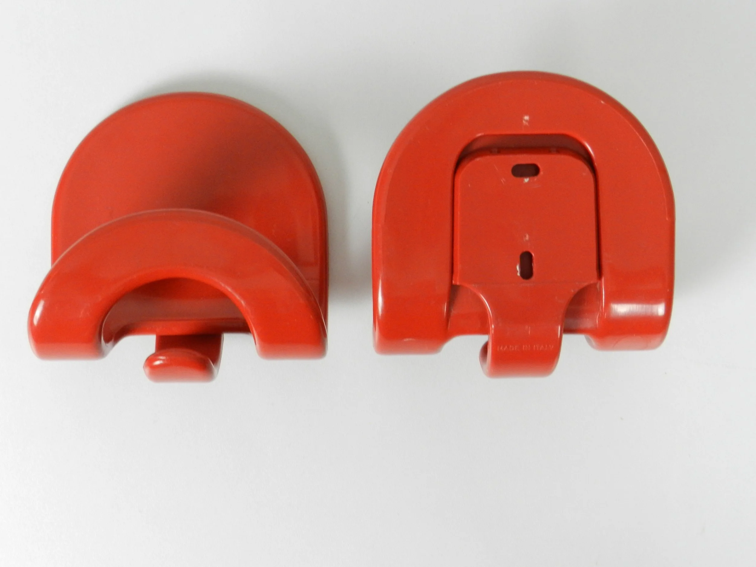 Pair of plastic coat hooks designed by Carlo Bartoli for Con and Con.  Italy, 1970s.