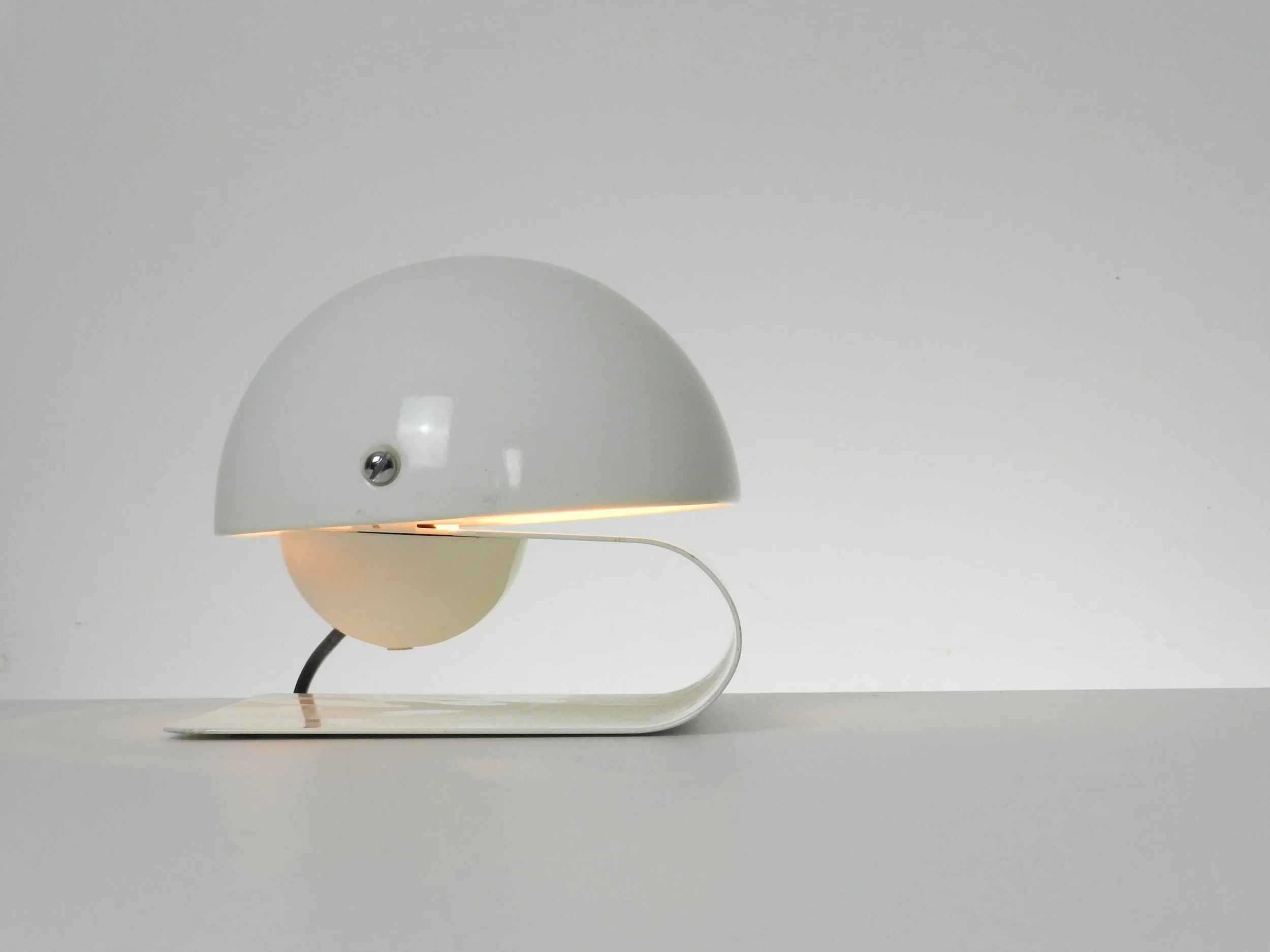 Space age Bugia lamp designed by Giuseppe Cormio for Guzzini.  In enameled metal with adjustable visors.  Italy, 1970s.