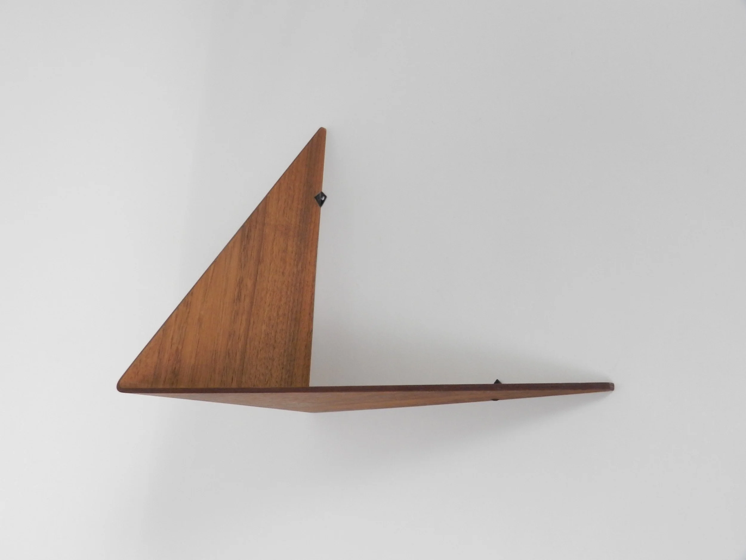 Wall shelf in bent plywood with teak veneer, designed by Poul Cadovius.  Denmark, 1960s.