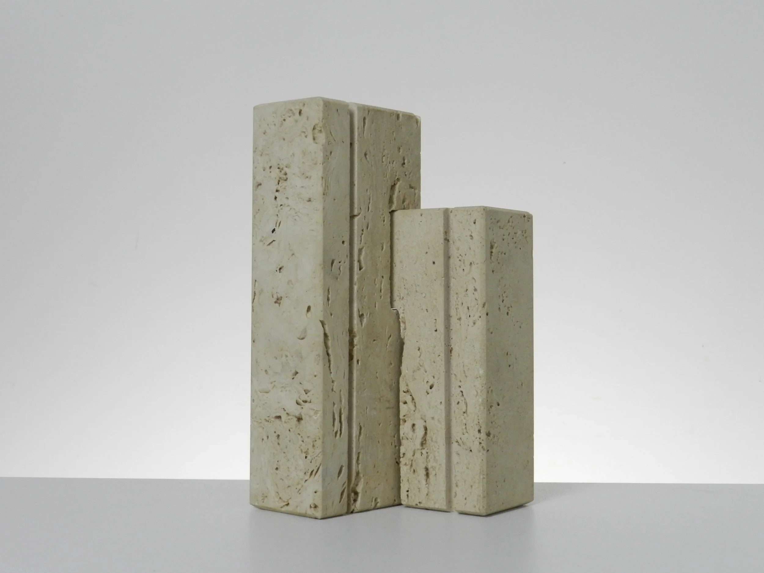 Travertine nesting candle holders designed by Fratelli Manelli.  Italy, 1960s.