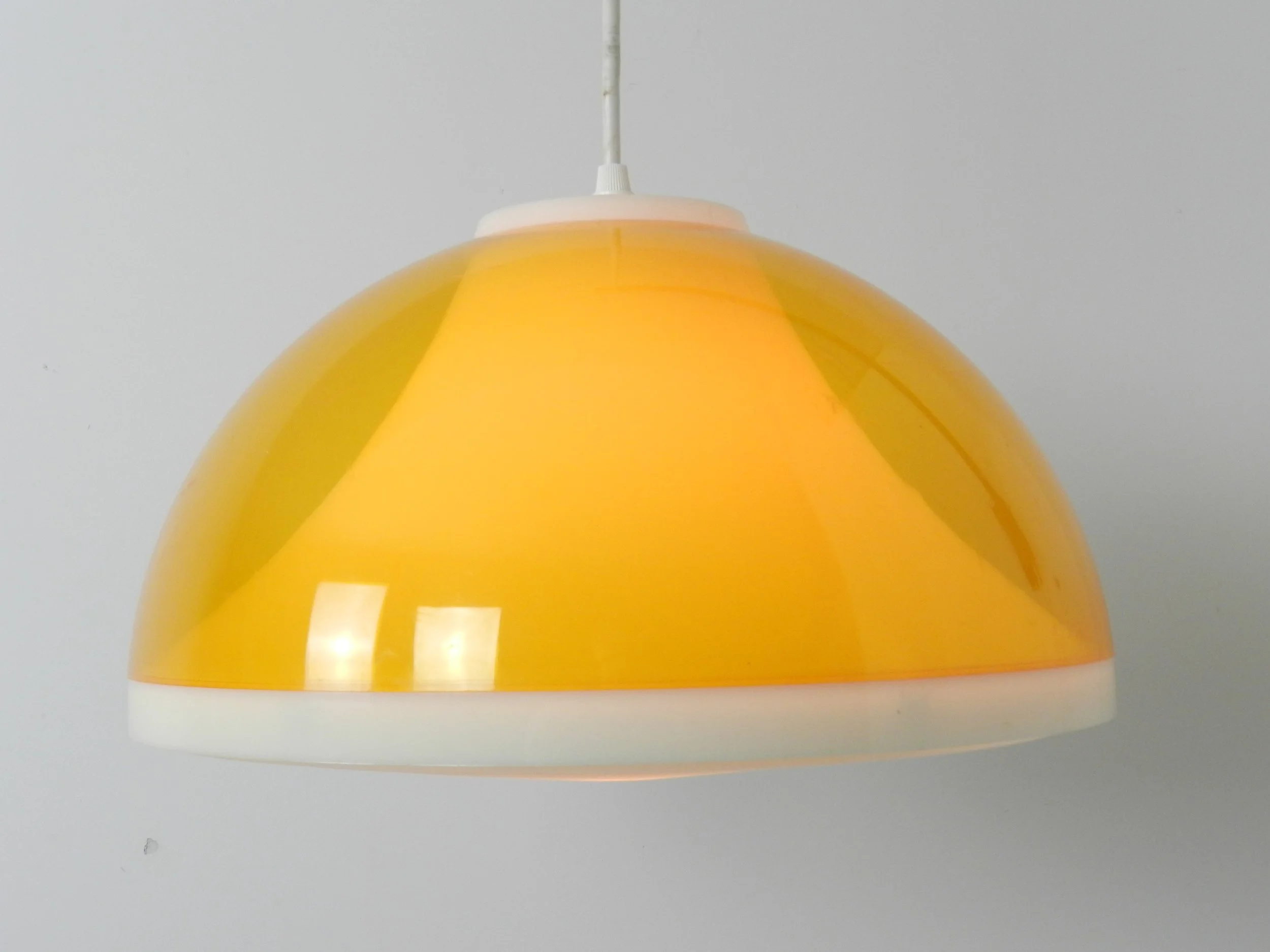 Mid century wall lamp with plastic shade and teak pivoting bracket.  Scandinavia, 1960s.