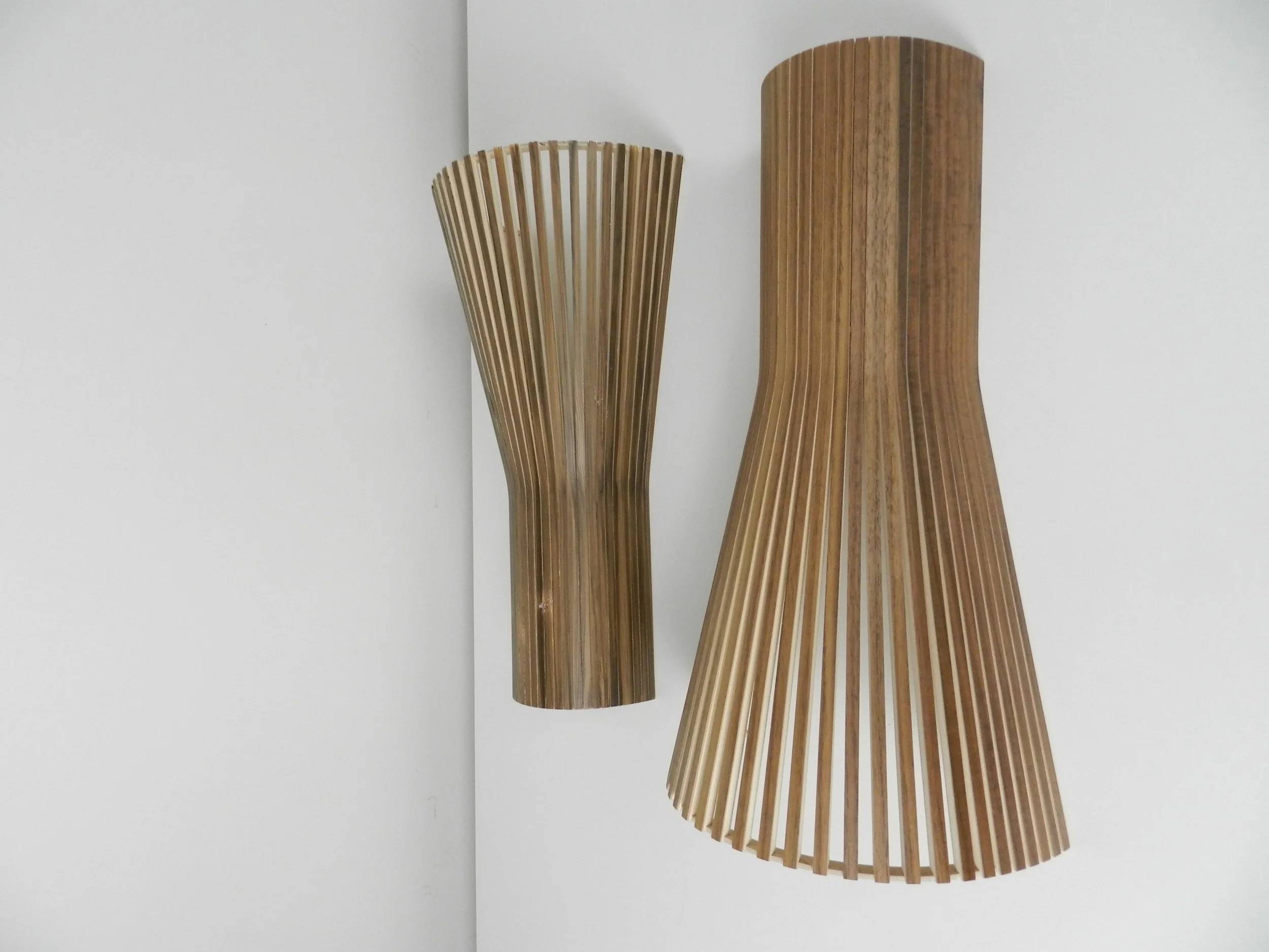 Pair of handmade wall sconces with plywood shades produced and designed by Secto Design in Finland.