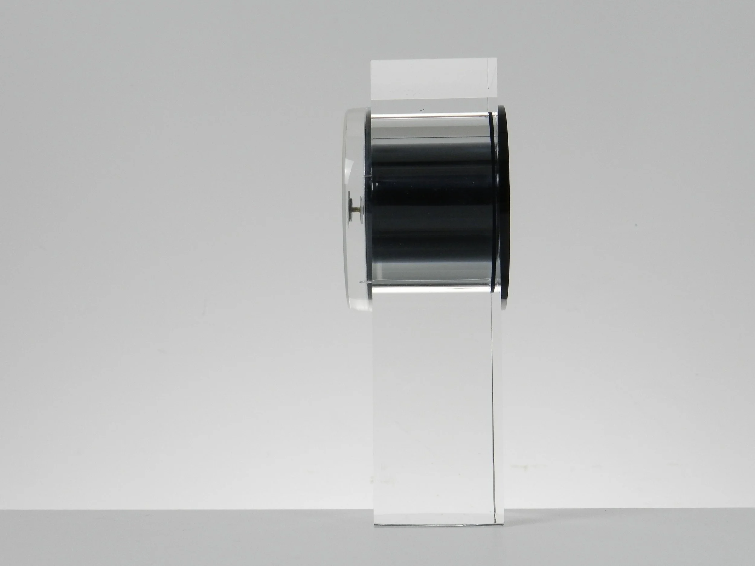 Modernist lucite clock designed by Felice Antonio Botta.  Italy, 1980s.