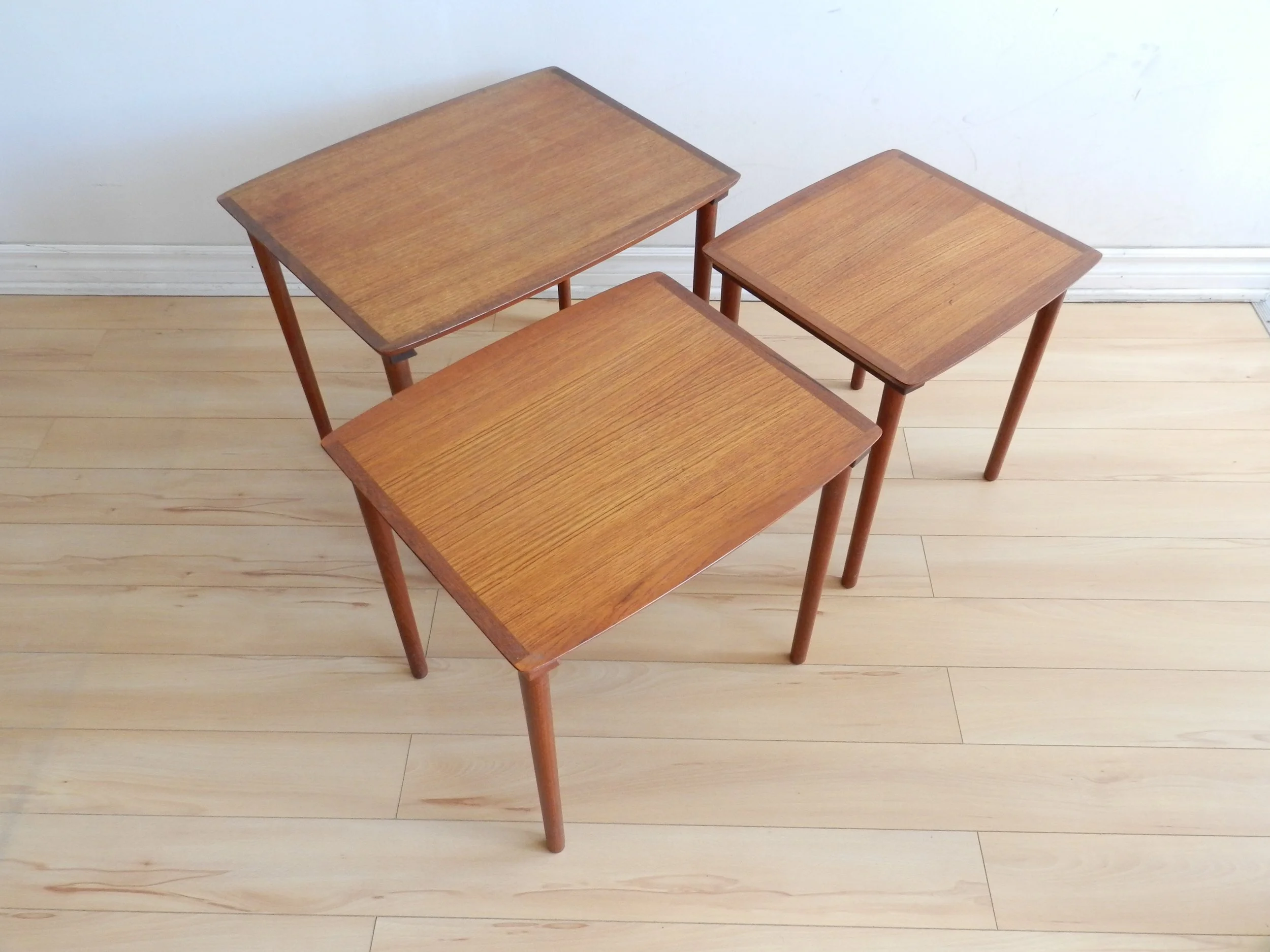 Set of three teak nesting tables by Mobelintarsia.  Denmark, 1960s.