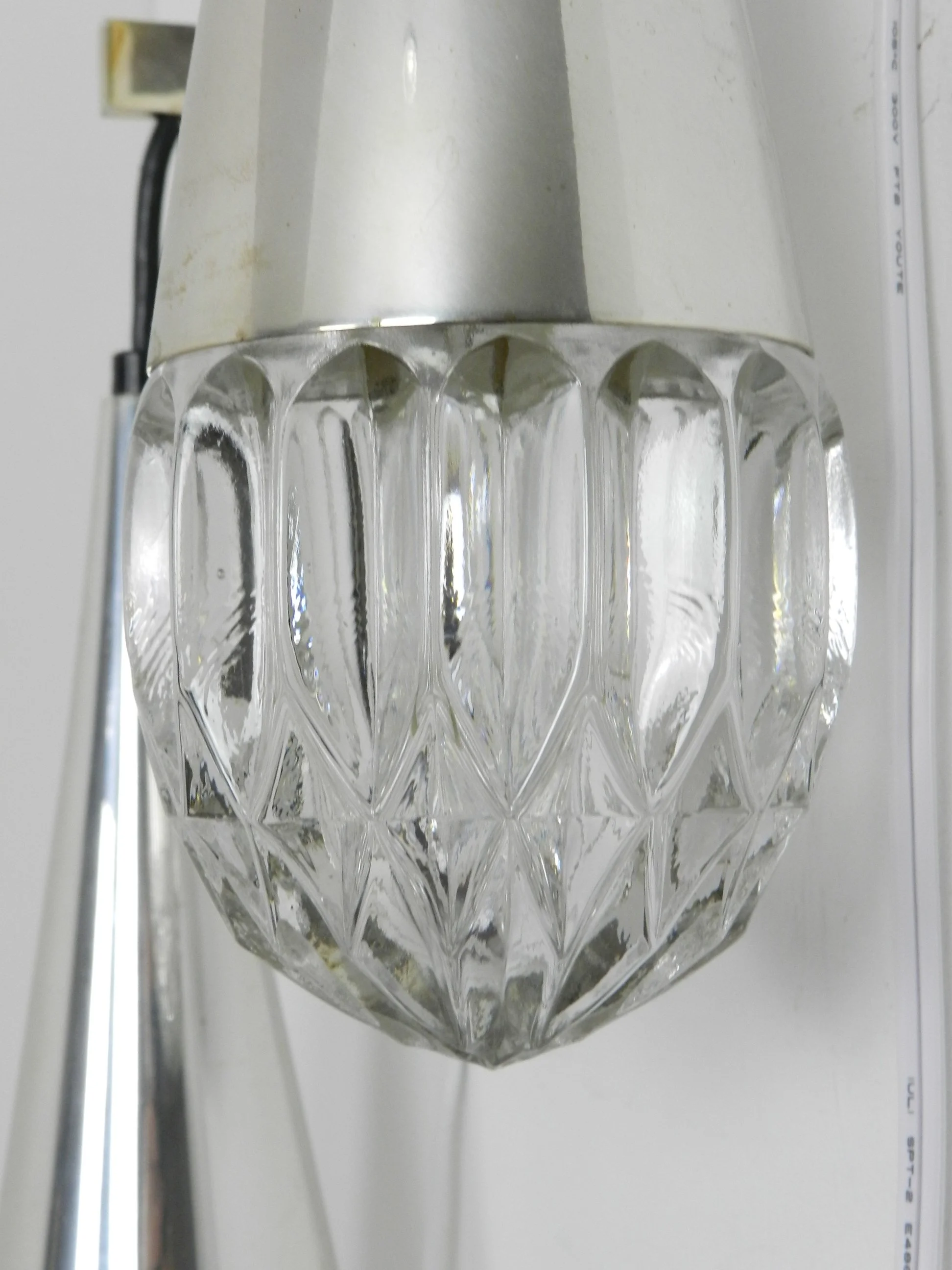 Pair of mid century wall lamps by Kaiser. Metal and rosewood with crystal glass shades.  Germany, 1970s.