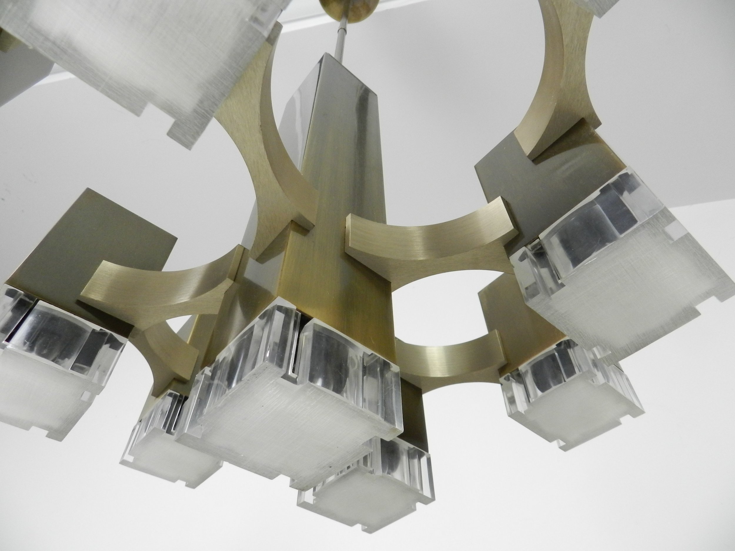 Modernist nine light “Cubic” chandelier designed by Gaetano Sciolari. In bronze plated metal with acrylic diffusers.  Italy, 1960s.