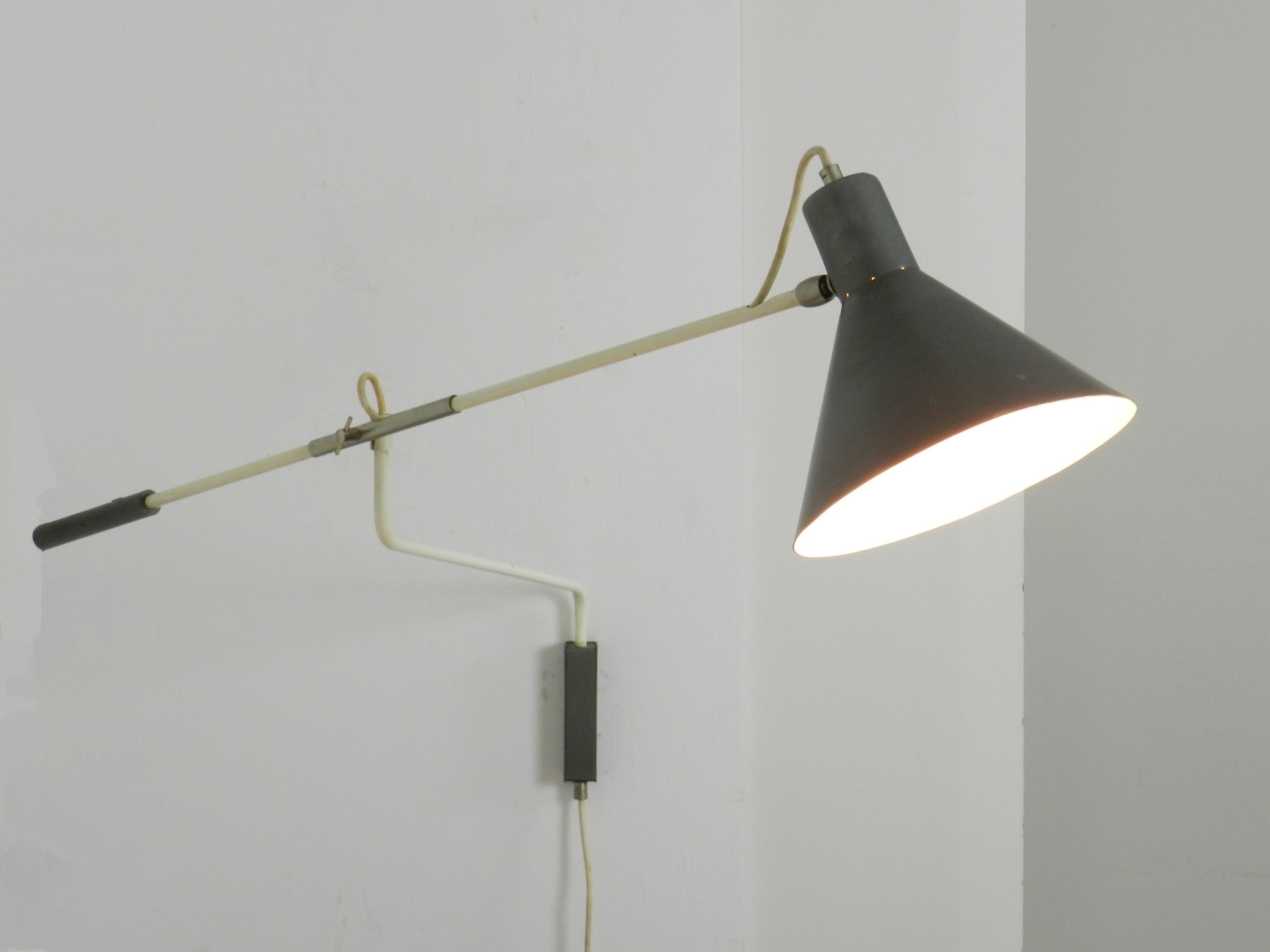 Mid century modern articulating wall lamp designed by JJM Hoogervorst for Anvia.  Netherlands, 1950s.