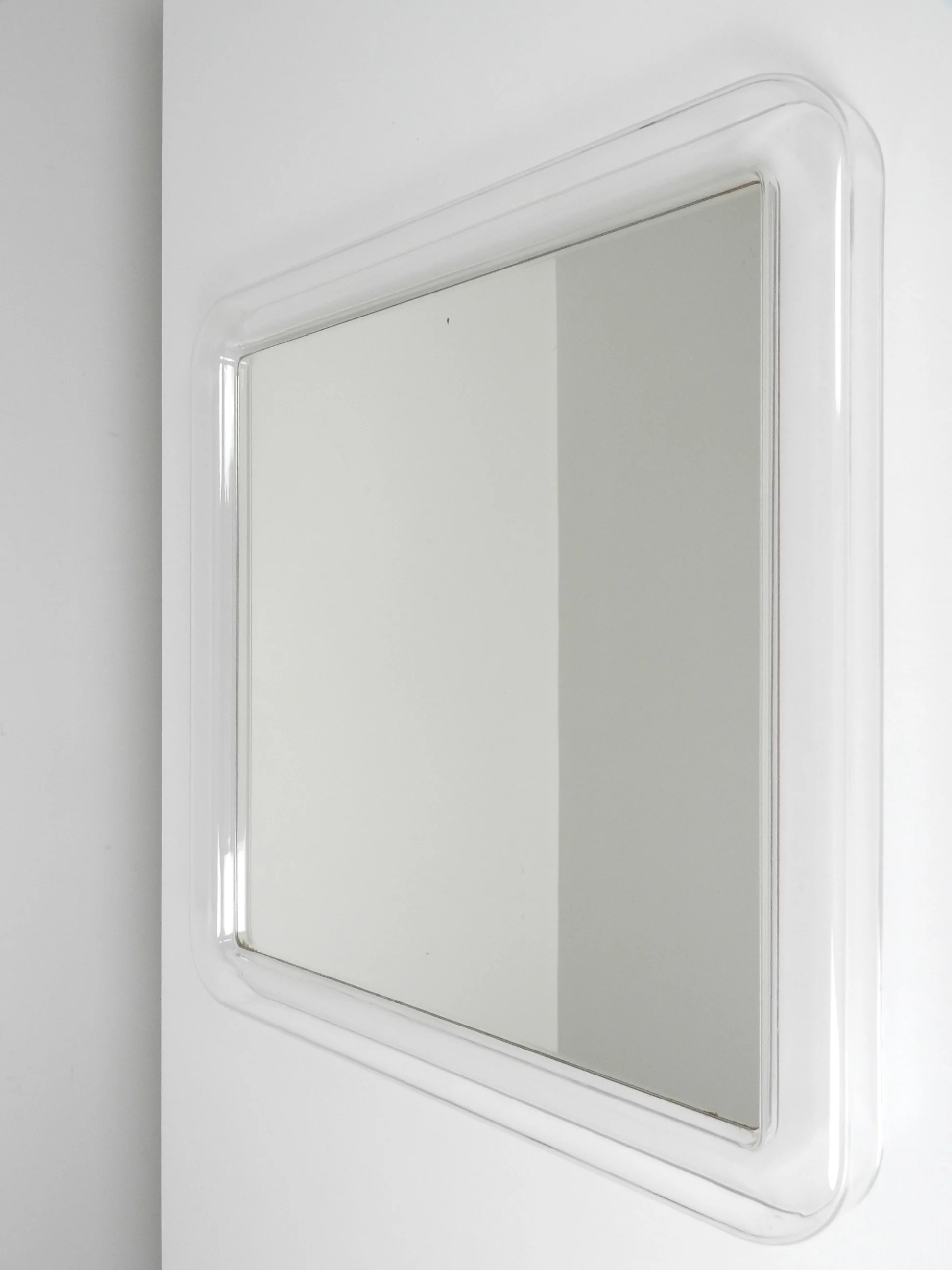 Modernist wall mirror with acrylic frame.  circa 1970s.