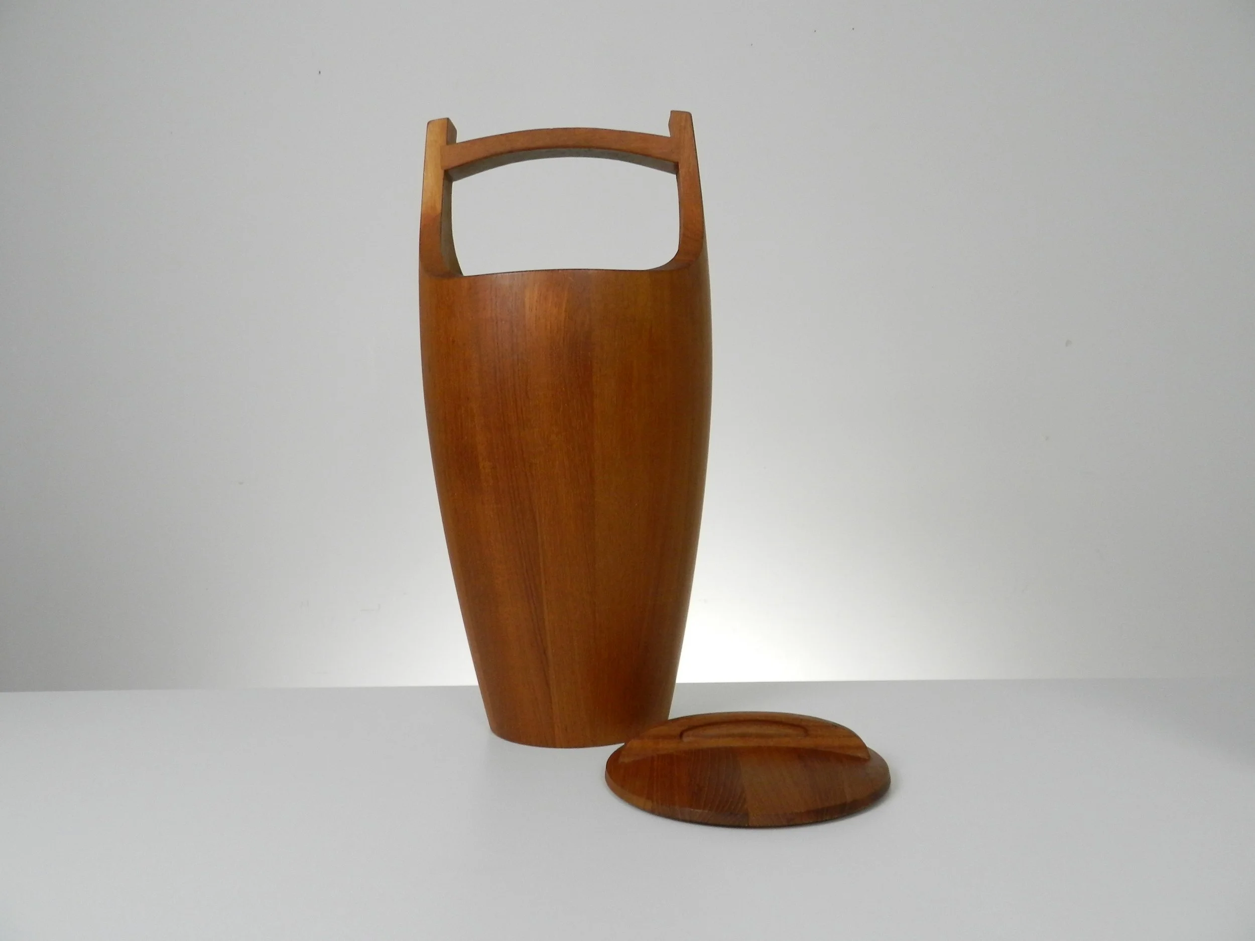 Congo ice buckets in staved teak designed by Jens Quistgaard for Dansk.  Denmark, 1960s.