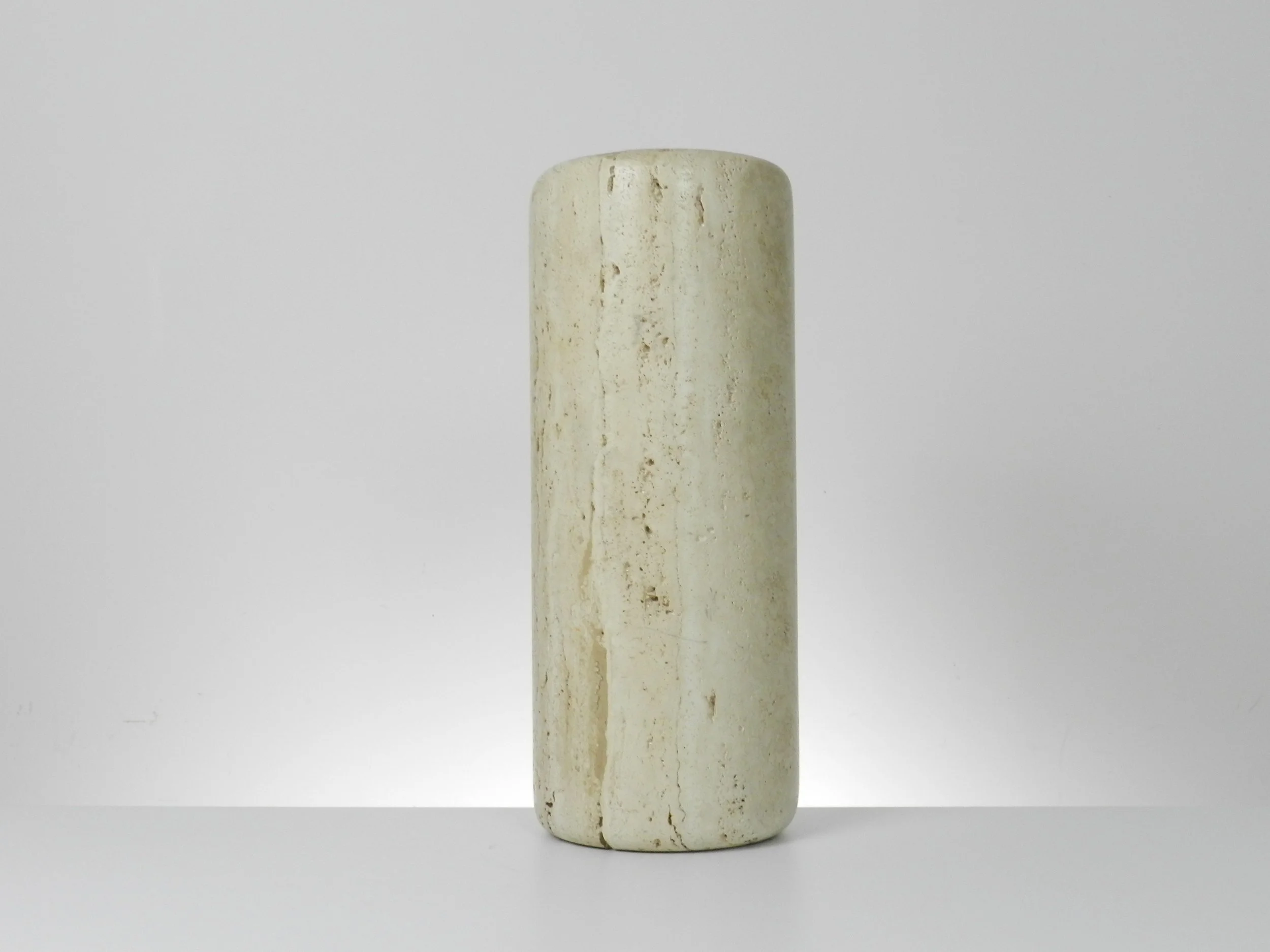 Tall travertine dry vase by Raymor.  Italy, 1970s.
