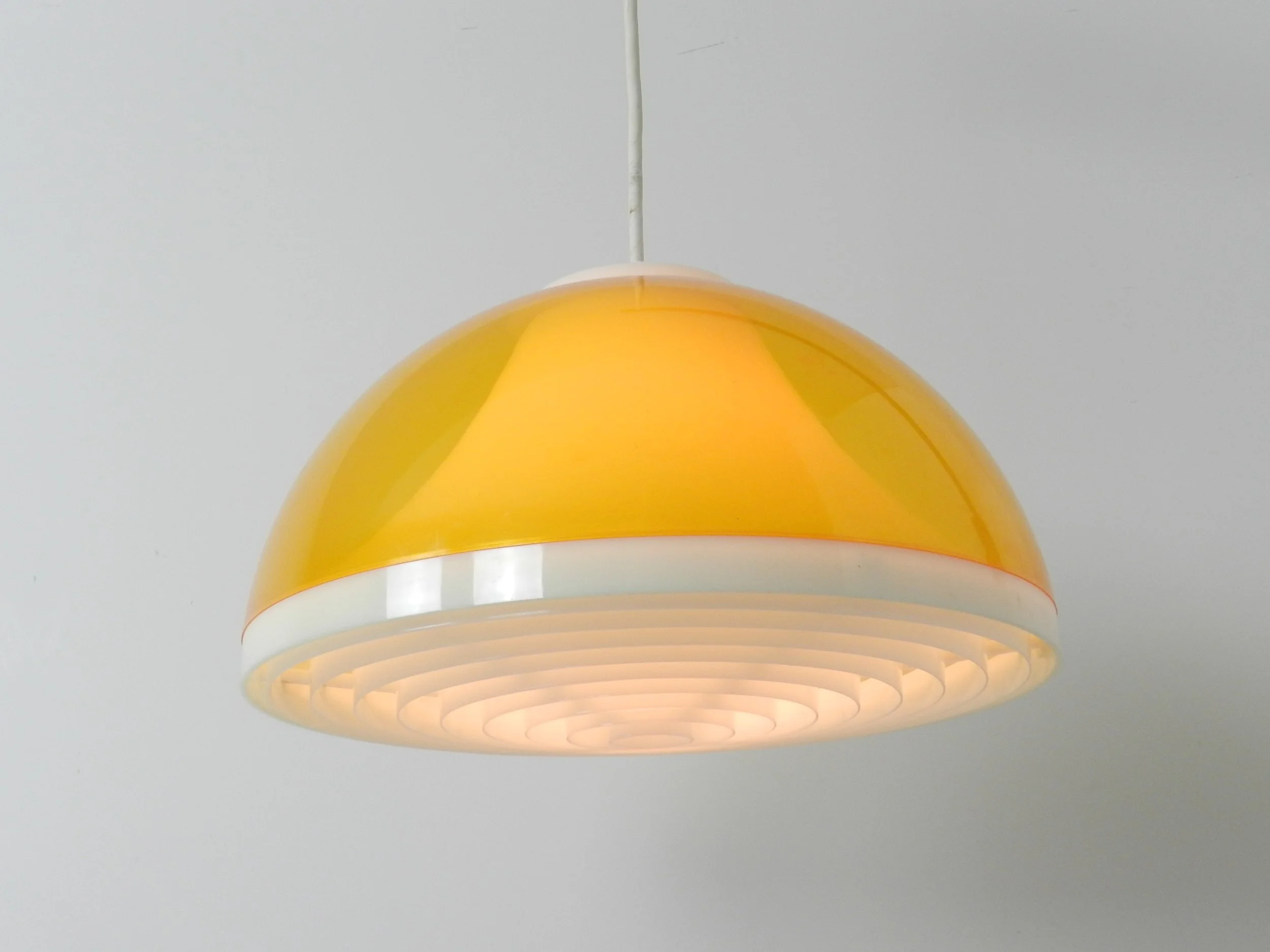 Mid century wall lamp with plastic shade and teak pivoting bracket.  Scandinavia, 1960s.