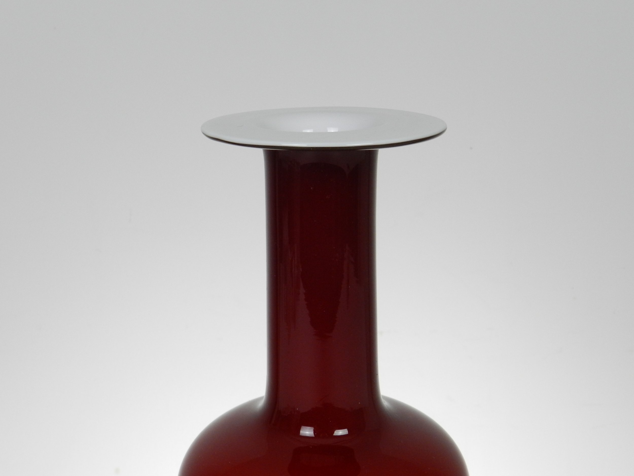 Deep red cased glass ‘Gulvase’ designed by Otto Brauer for Holmegaard.  Denmark, 1960s.  12” high.