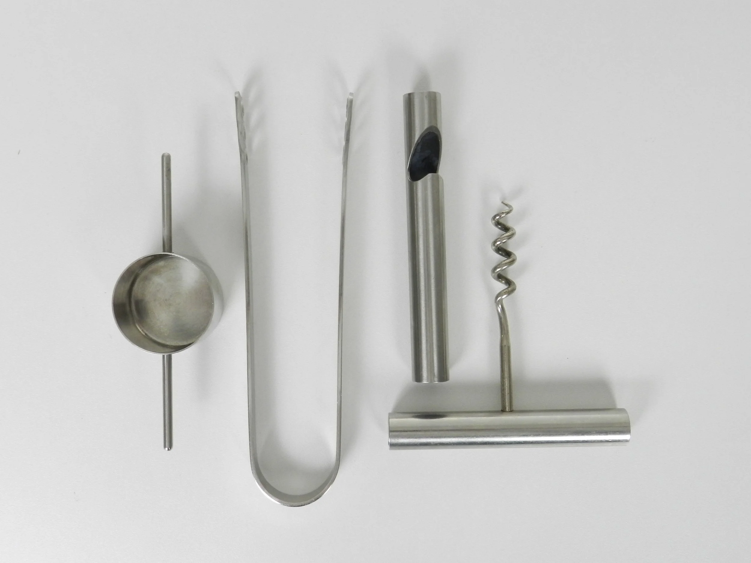 Set of four bar utensils designed by Arne Jacobsen and Peter Holmblad.  Denmark, 1970s.