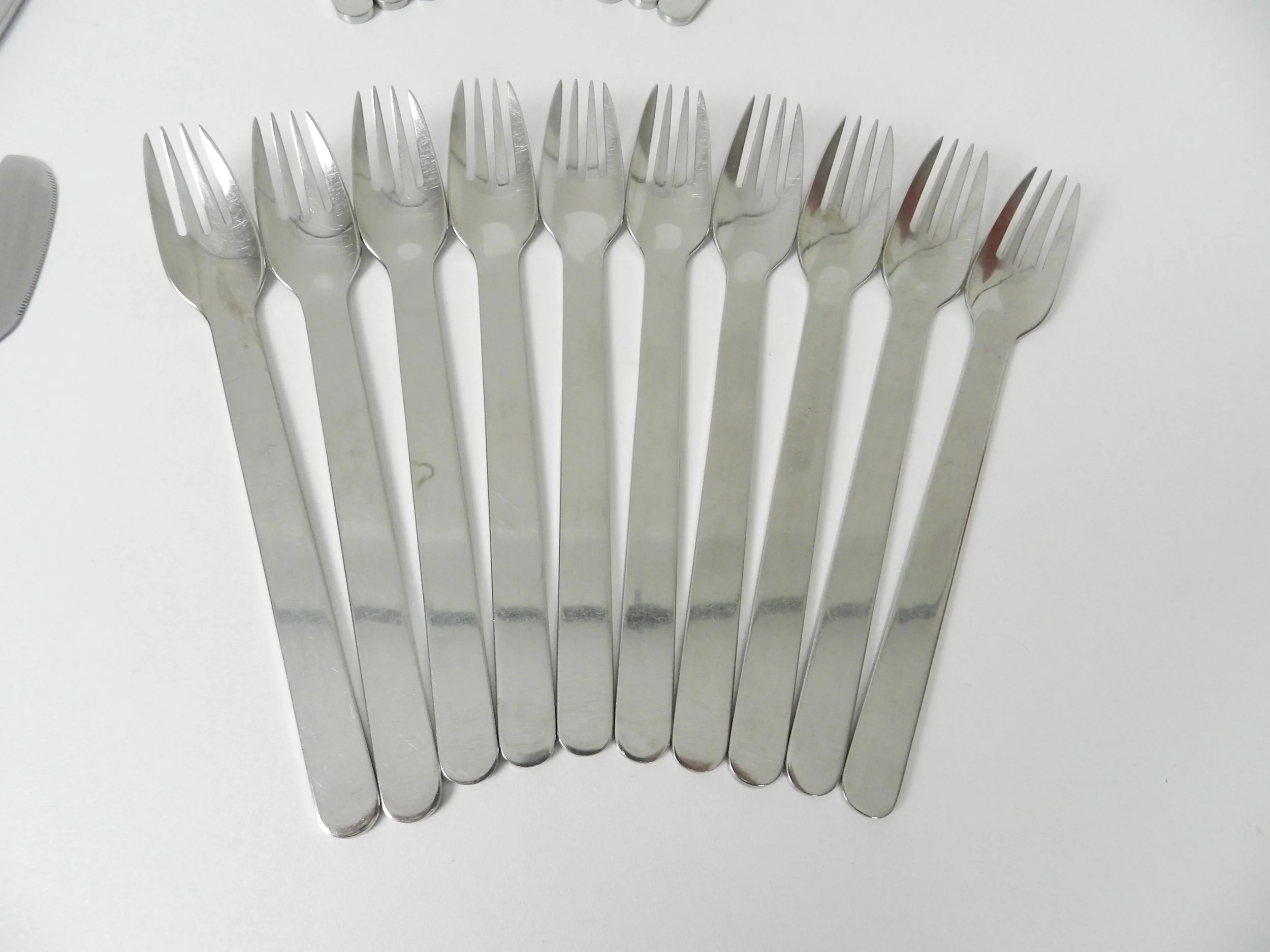 Stainless steel flatware designed by Louise Campbell for Georg Jensen, Denmark.