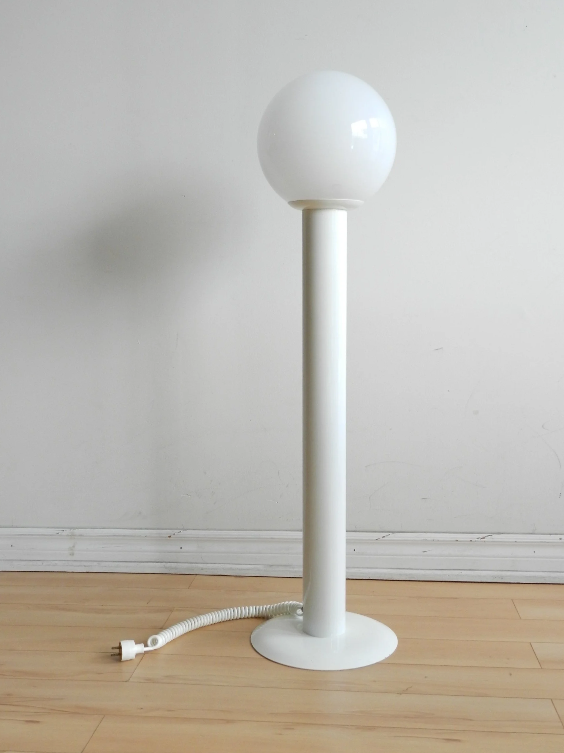 Space age floor lamp in enameled metal with glass shade.  circa 1970s.