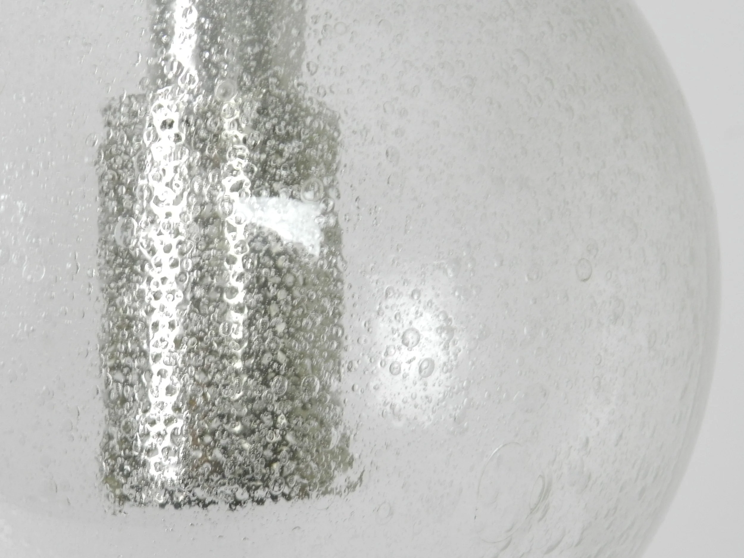 Vintage bubbble glass pendant with chrome hardware. Possibly by Lightolier.  circa 1970s