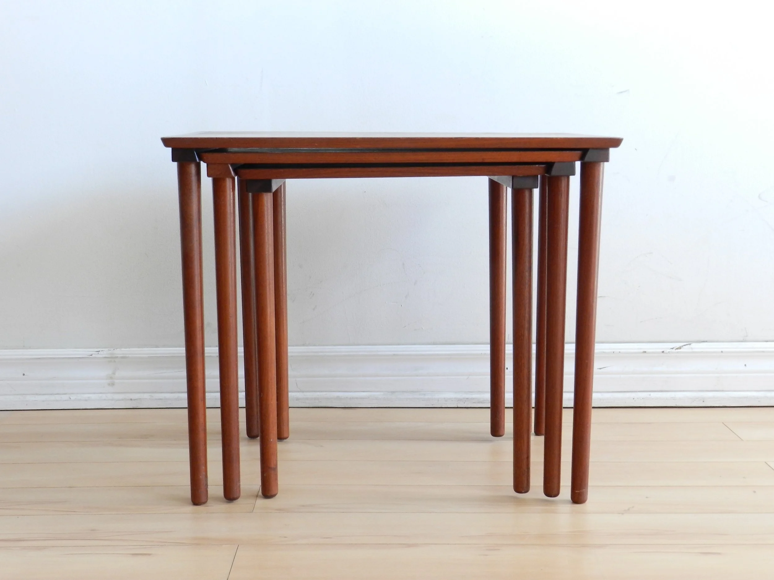 Set of three teak nesting tables by Mobelintarsia.  Denmark, 1960s.
