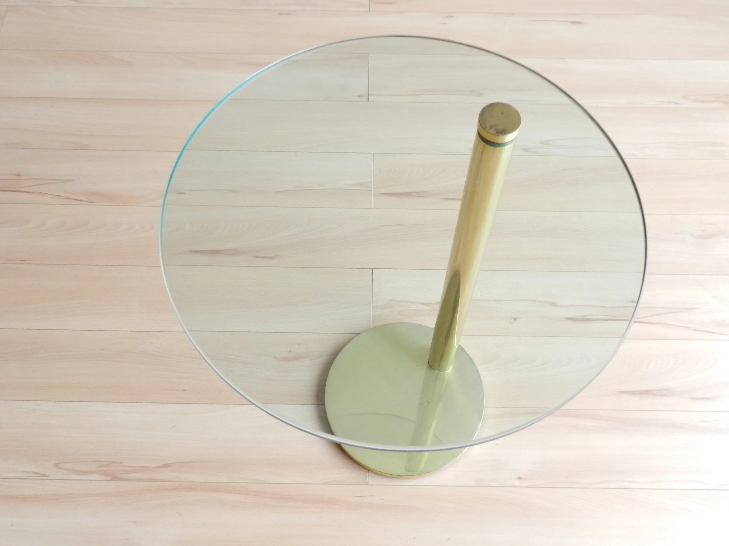 Post modern side table in brass with cantilevered glass top attributed to Prismatique.  Canada, 1980s.