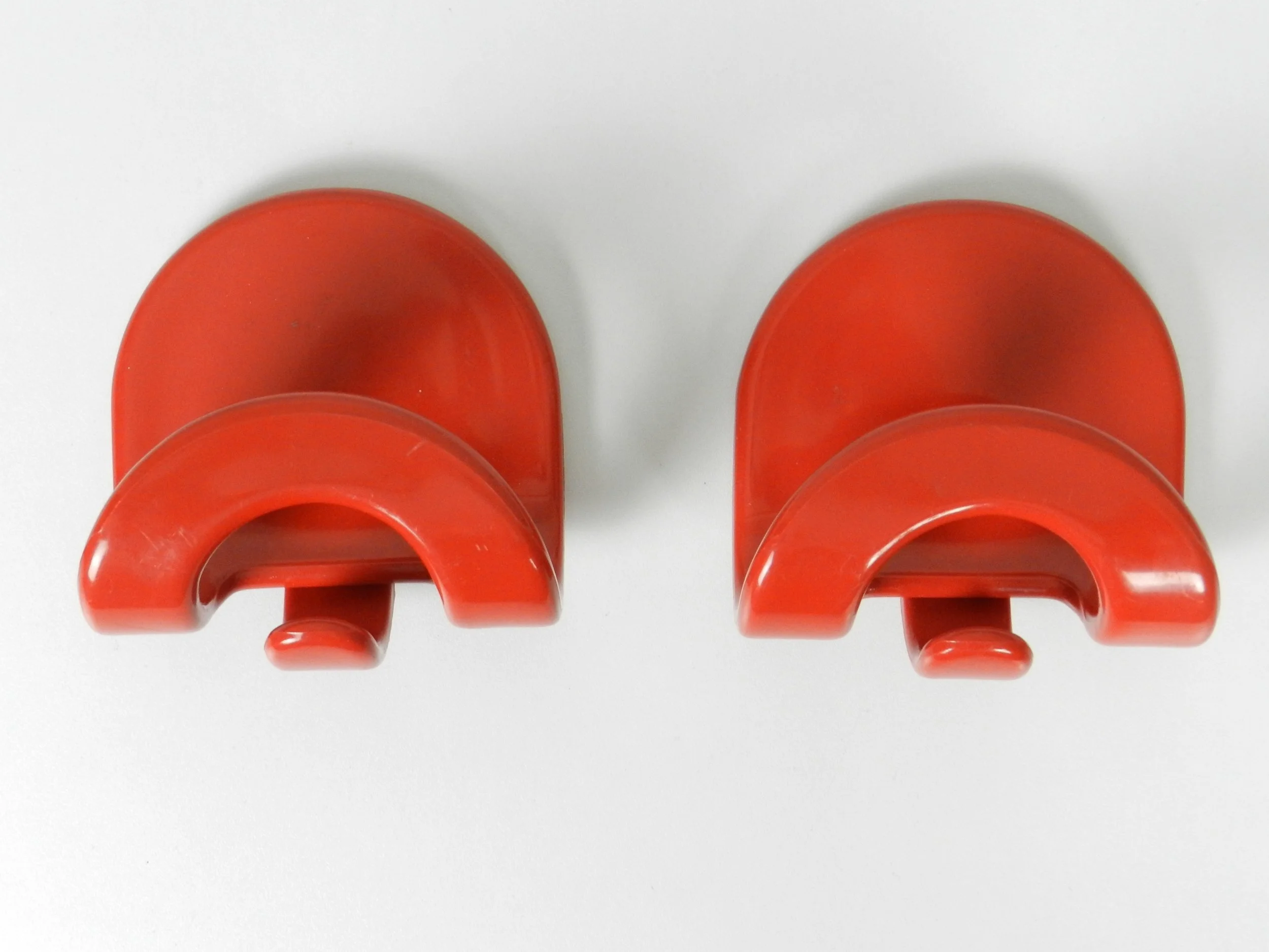 Pair of plastic coat hooks designed by Carlo Bartoli for Con and Con.  Italy, 1970s.