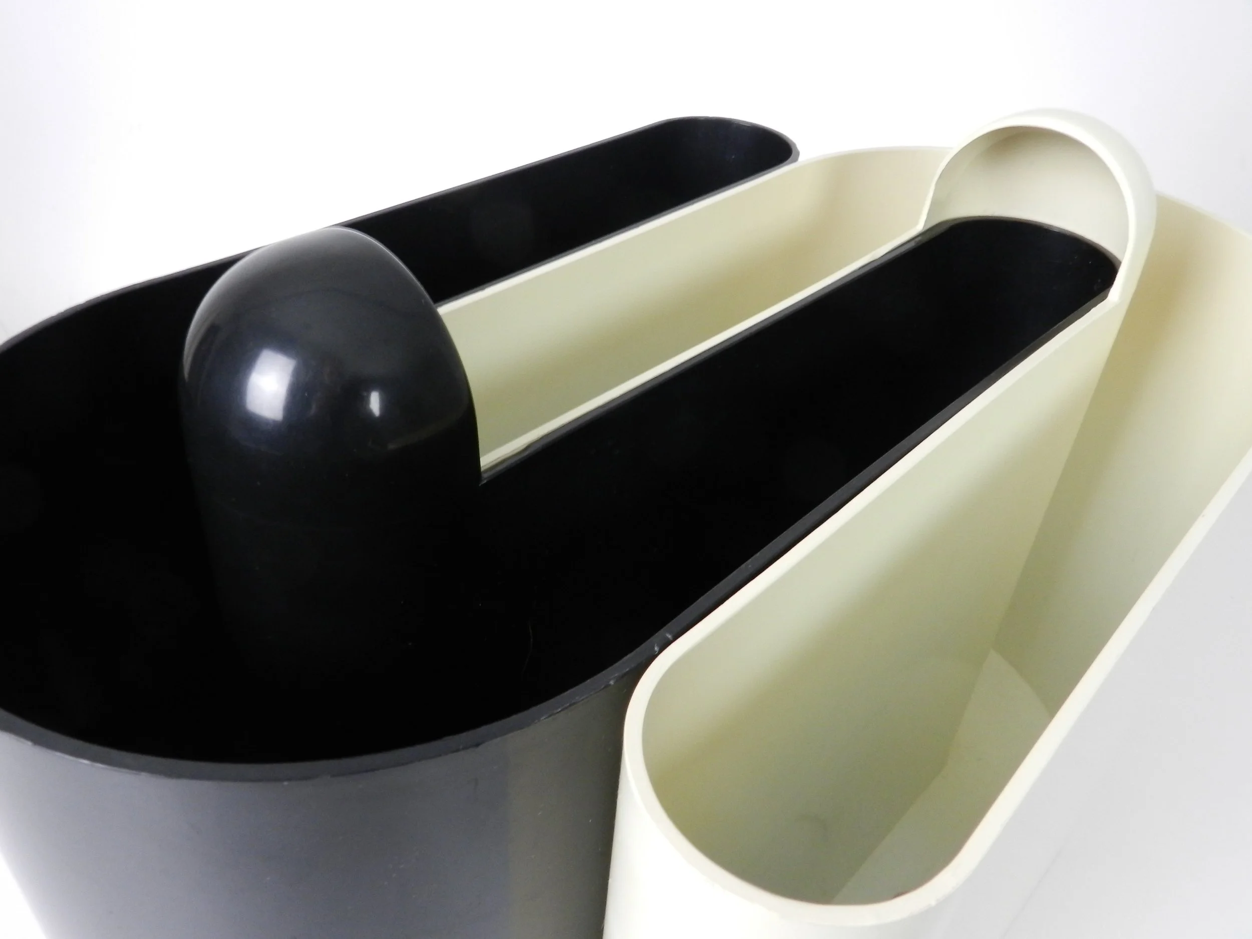 Pair of nesting plastic magazine racks designed by Rodolfo Bonetto for Vastill.  Italian design, manufactured in Canada, 1960s.