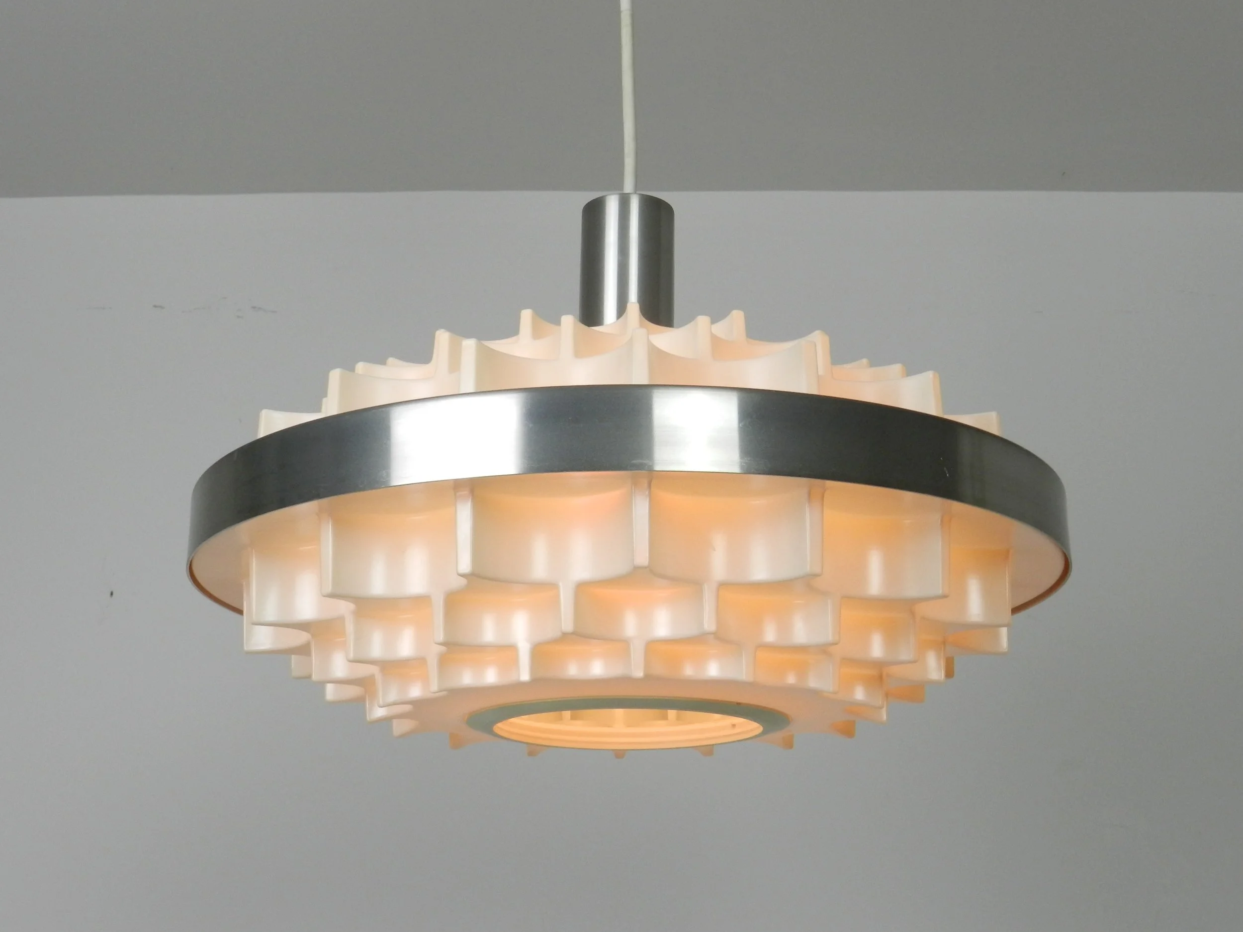 Mid century pendant lamp in plastic and aluminum. Attributed to Lars Schioler for Hoyrup.  Denmark, 1960s.