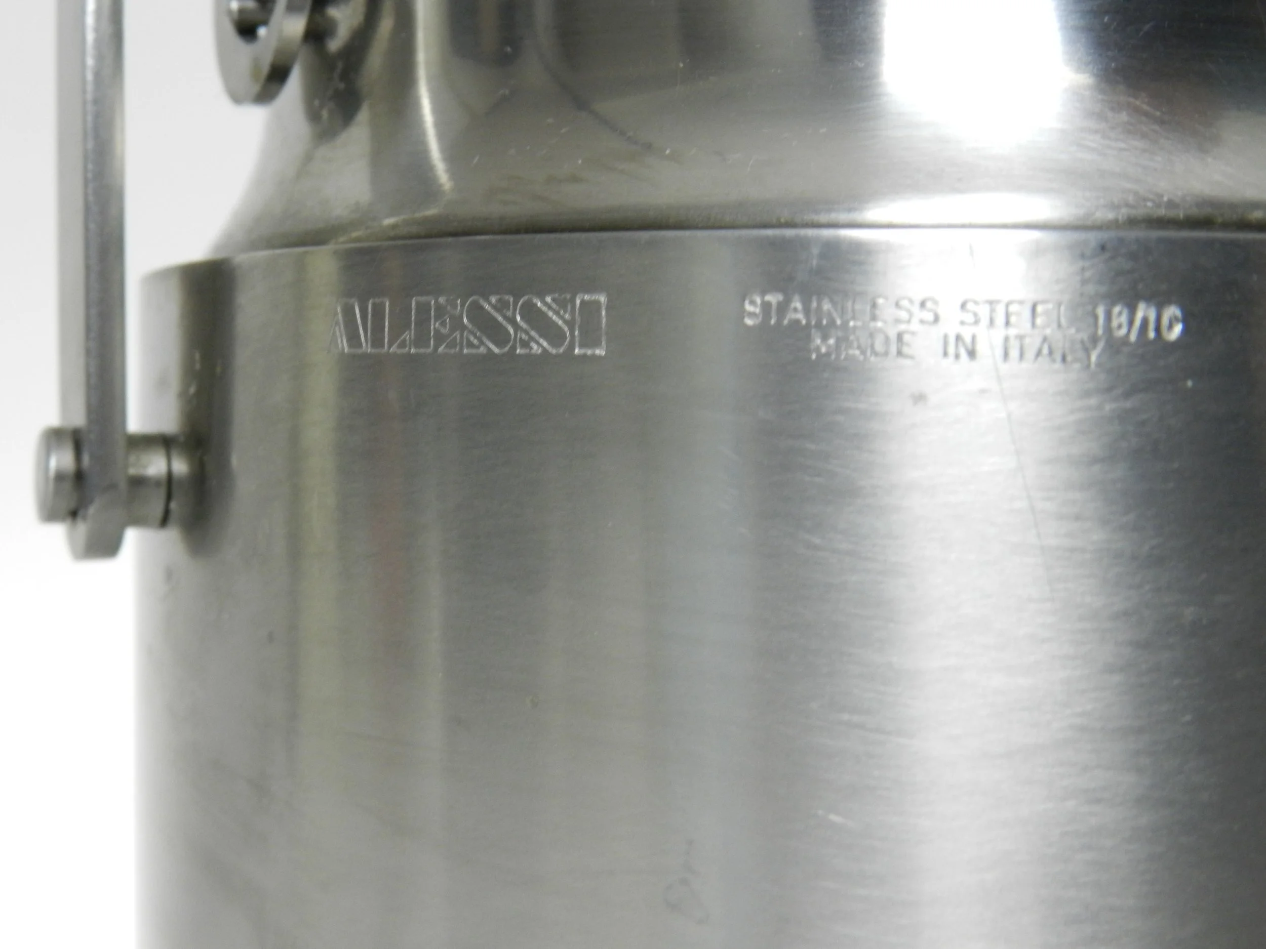 Stainless steel ice bucket with mechanical lid, glass interior and plastic liner. Designed by Anselmo Vitale and Carlo Mazzeri for Alessi.  Italy, 1970s.