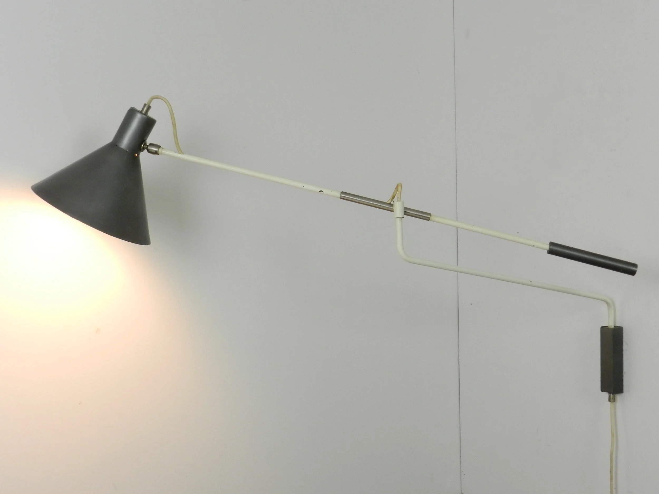 Mid century modern articulating wall lamp designed by JJM Hoogervorst for Anvia.  Netherlands, 1950s.