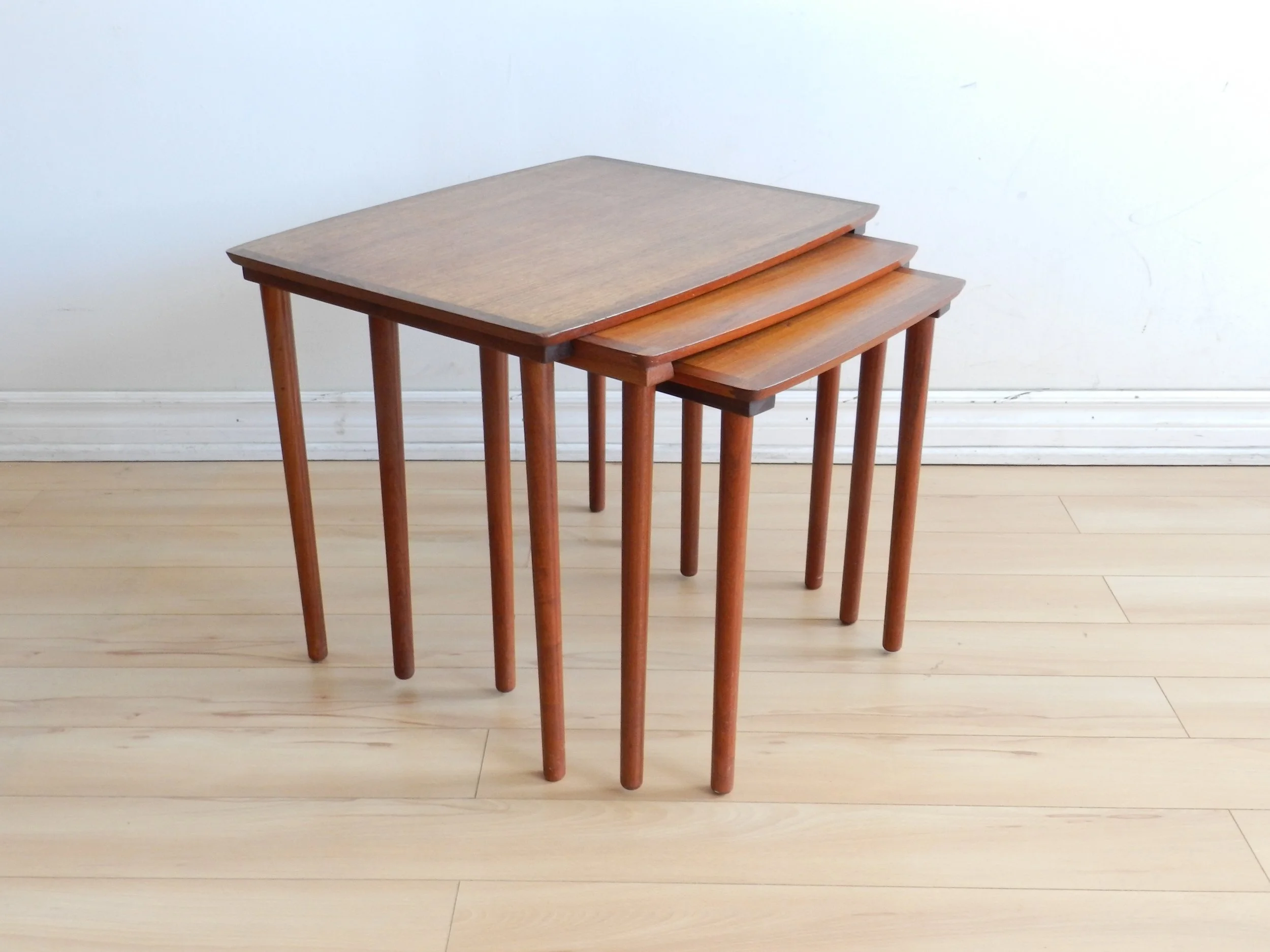 Set of three teak nesting tables by Mobelintarsia.  Denmark, 1960s.