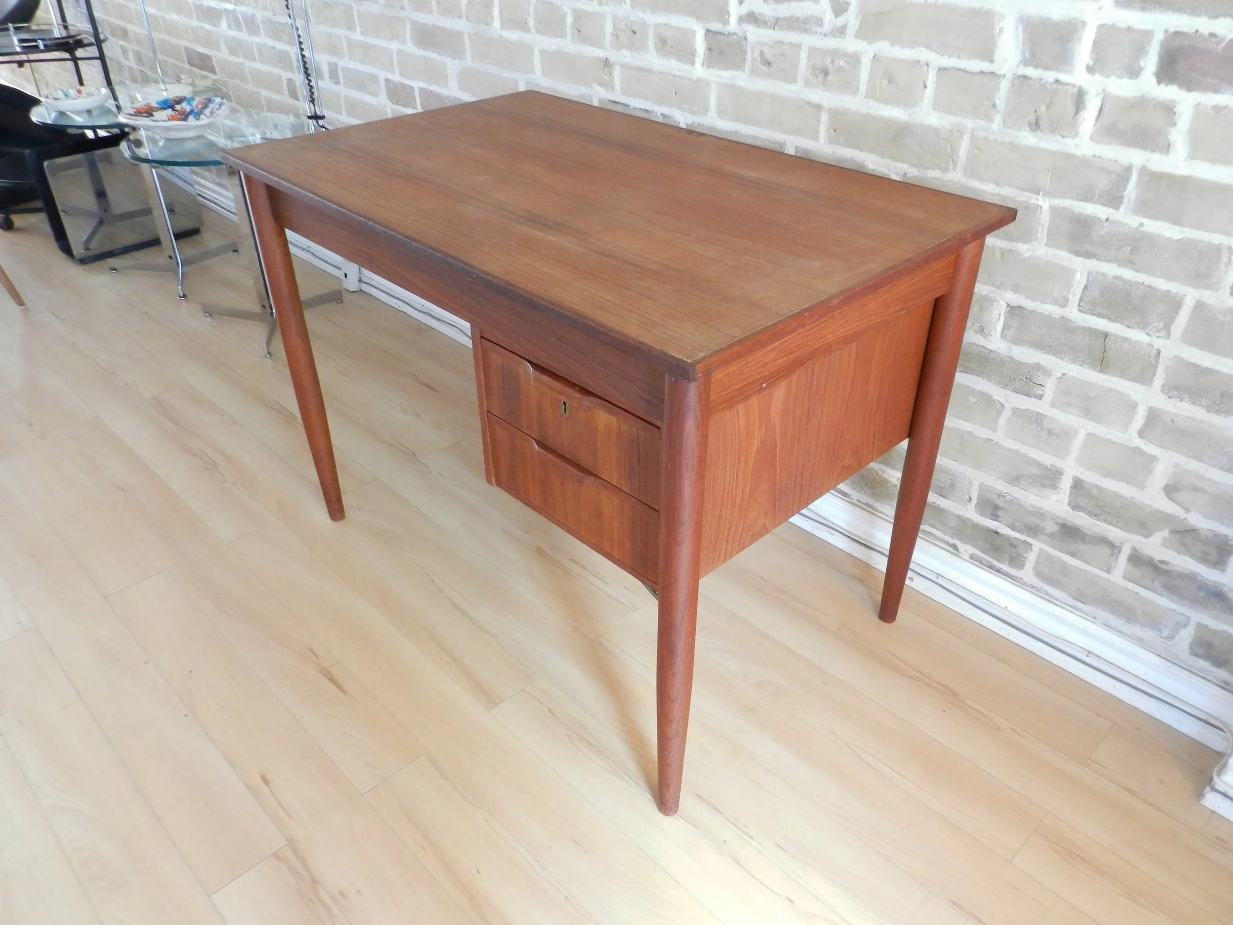 Compact teak desk with two drawers.  Denmark, 1960s.