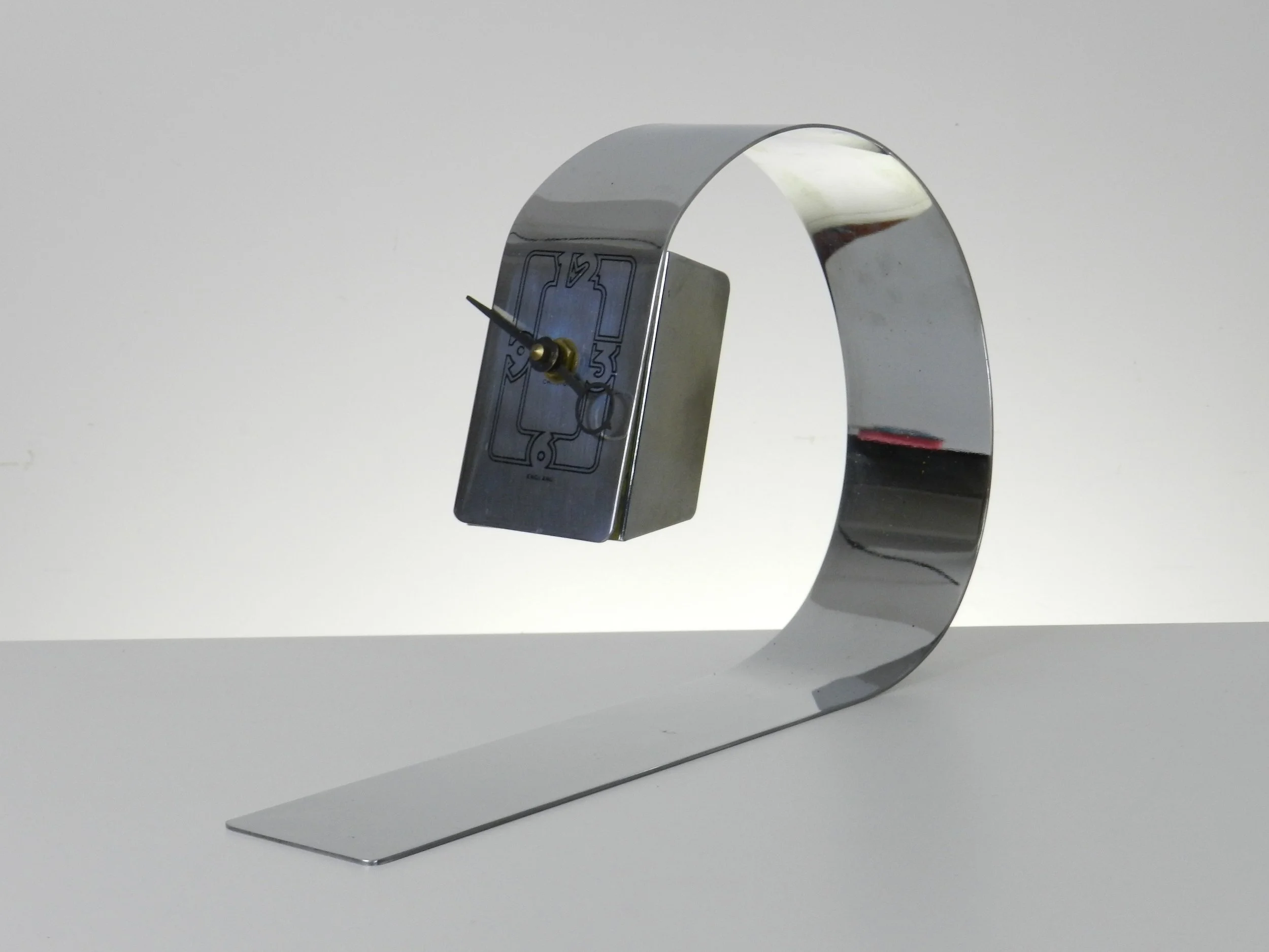 Space age desk clock in chromed steel.  England, 1970s.