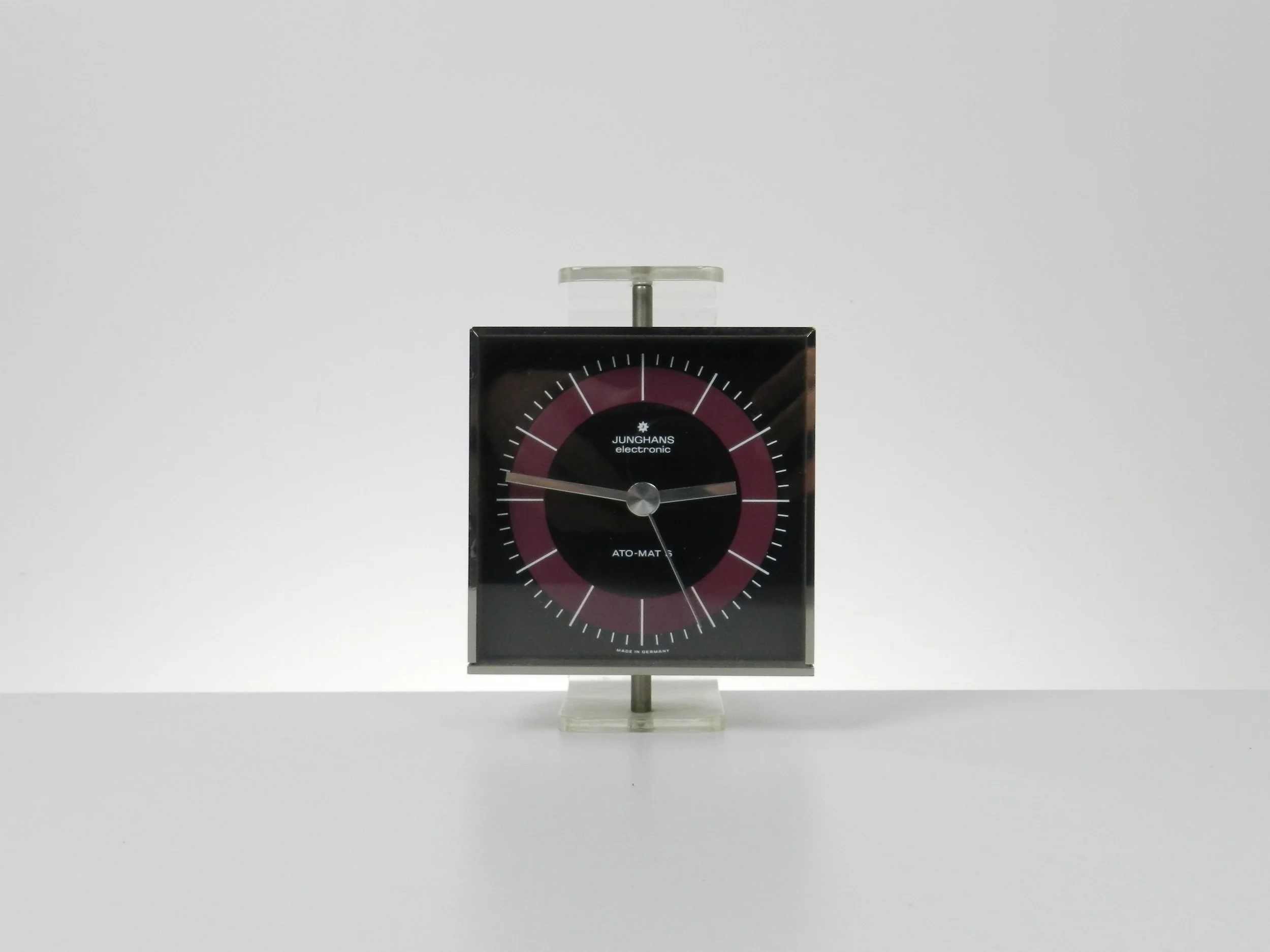 Modernist clock in steel and lucite by Junghans. Table top or wall mounted.  Germany, 1970s.
