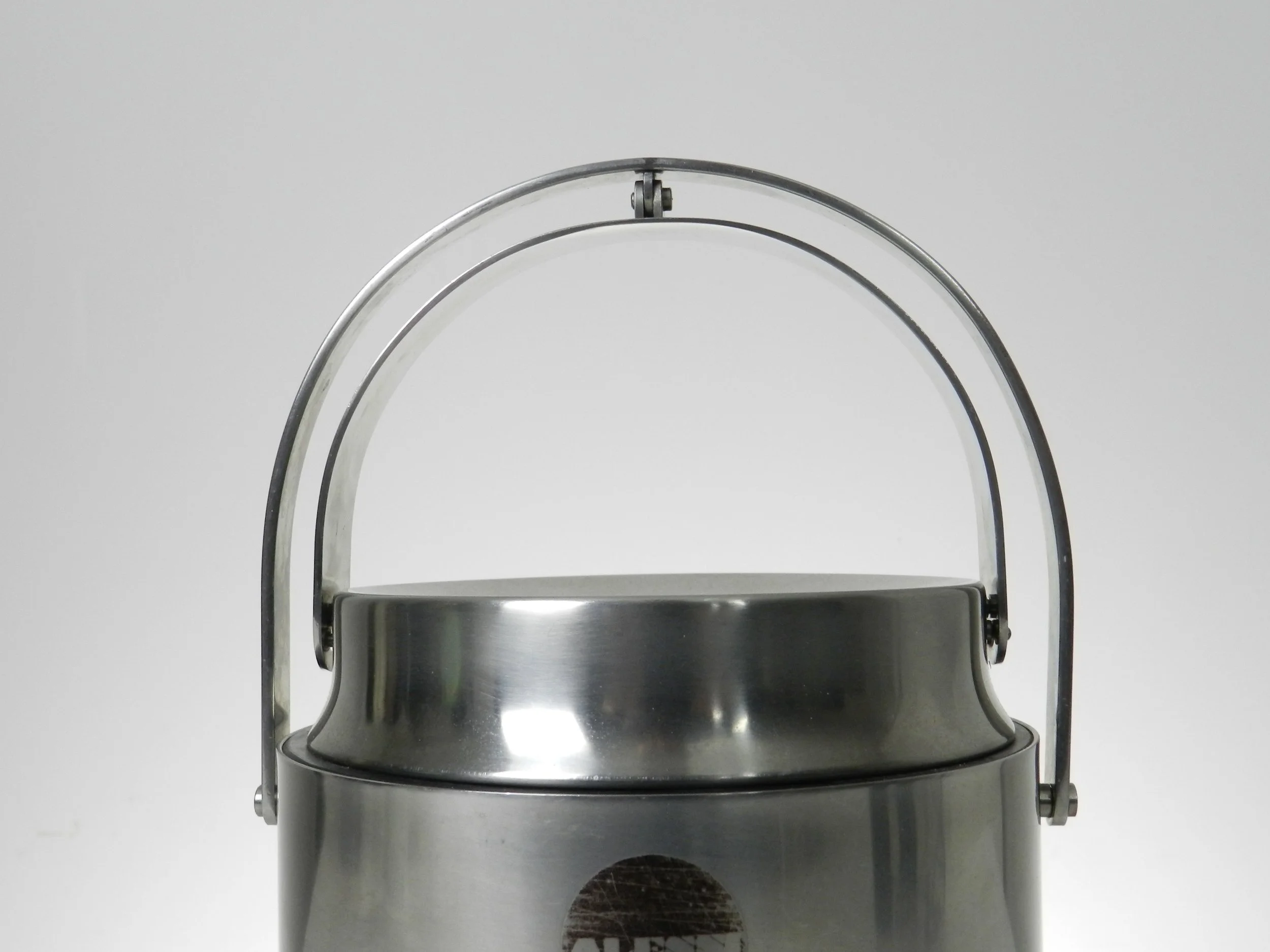 Stainless steel ice bucket with its mechanical lid, glass interior and plastic liner. Designed by Anselmo Vitale and Carlo Mazzeri for Alessi.  Italy, 1970s.