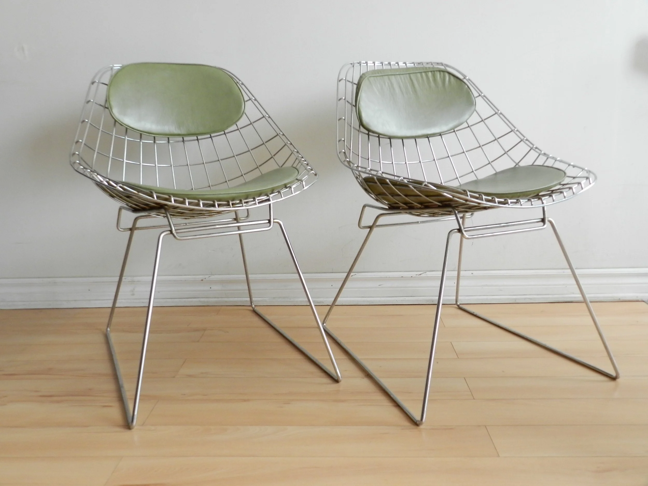 Pair of sculptural side chairs in chromed steel wire designed by Cees Braakman for Pastoe.  Netherlands, 1960s.
