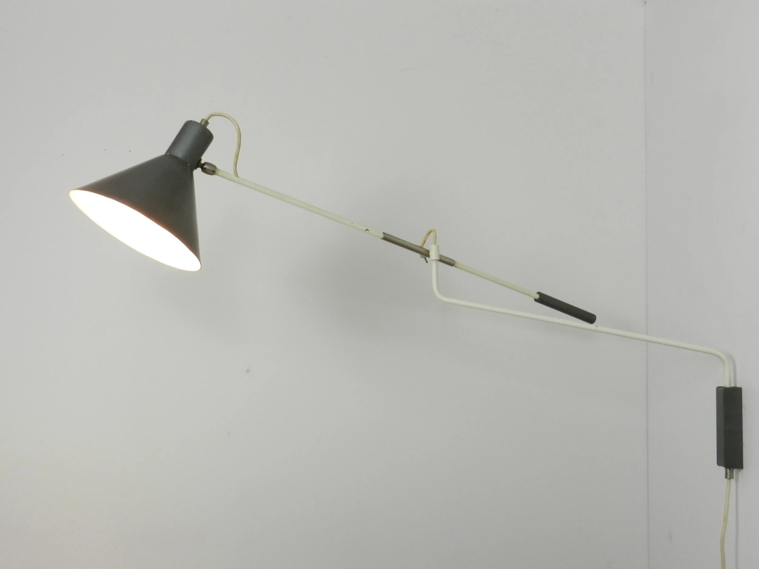 Mid century modern articulating wall lamp designed by JJM Hoogervorst for Anvia.  Netherlands, 1950s.