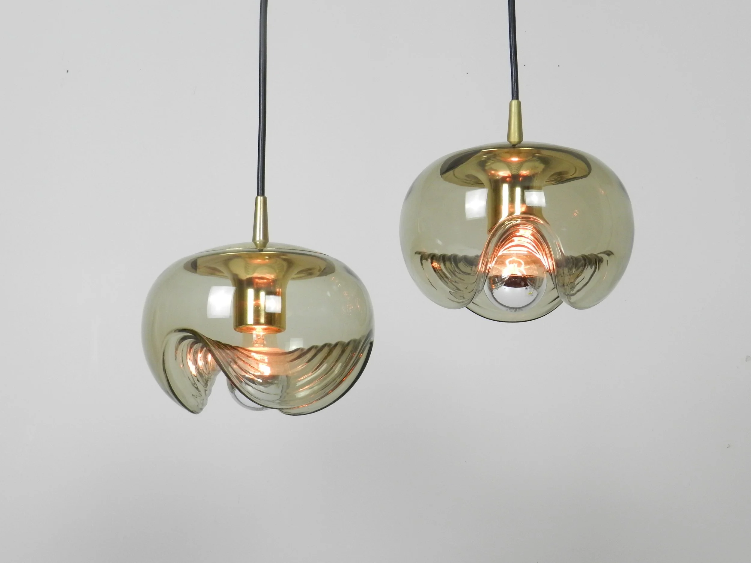 Brass and tinted glass pendant lamps by Peill and Putzler.  Germany, 1970s.