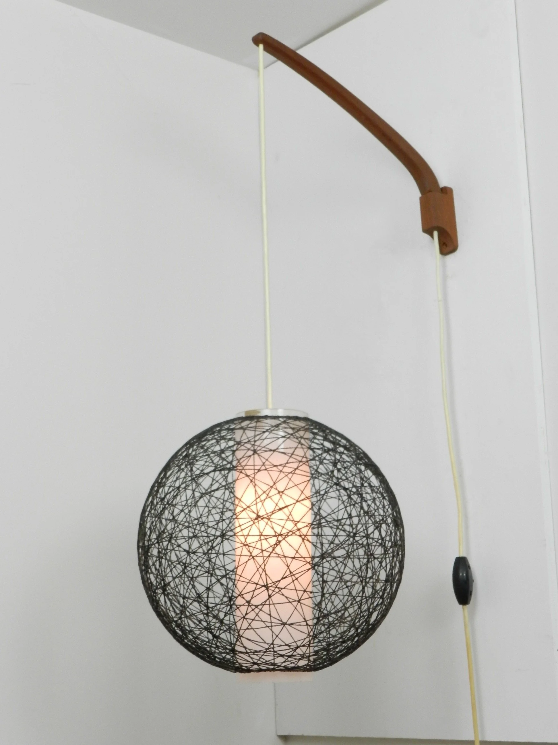 Scandinavian mid century wall lamp in teak with glass and string shade.  Finland, 1960s.