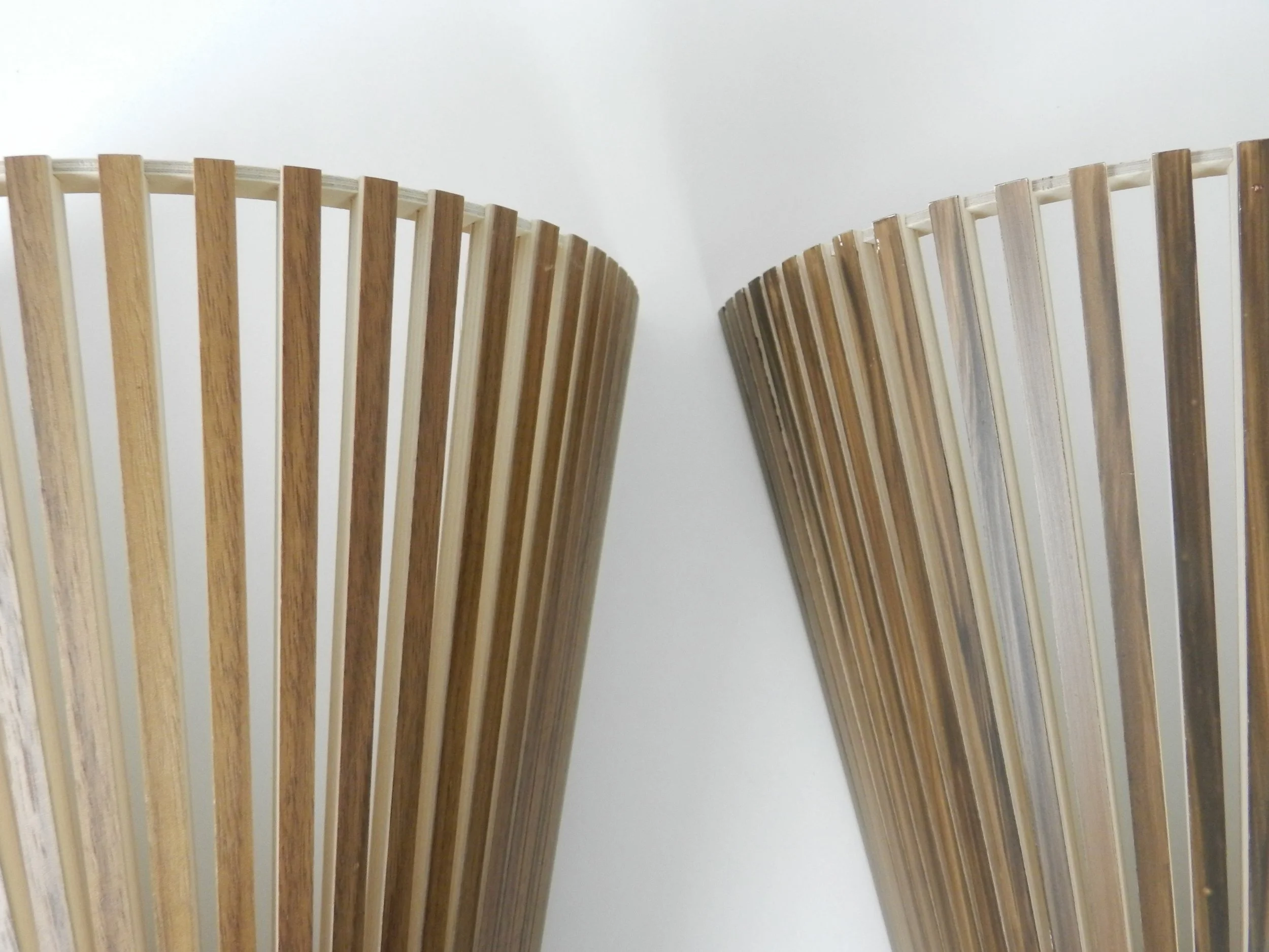 Pair of handmade wall sconces with plywood shades produced and designed by Secto Design in Finland.
