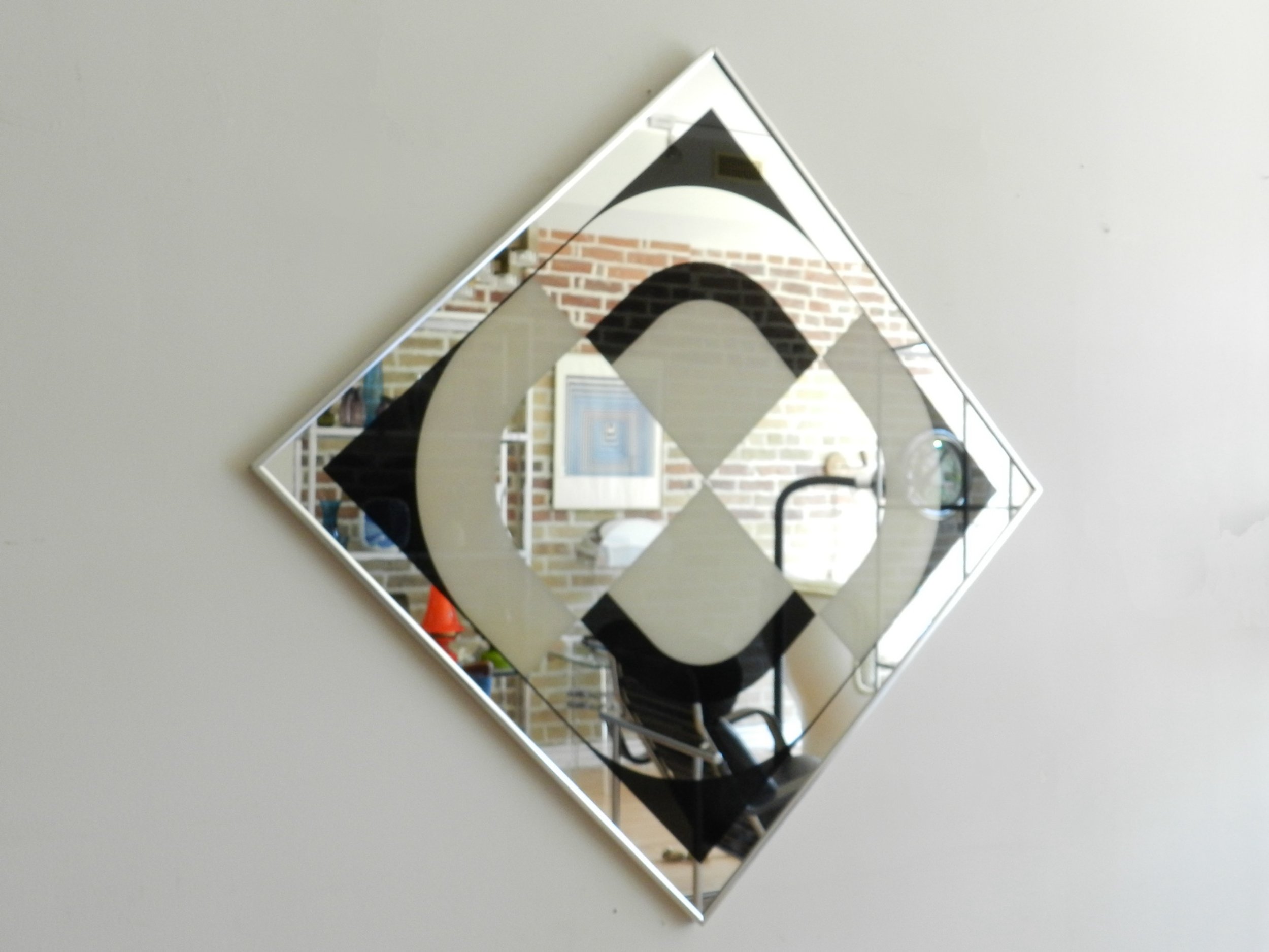 Op Art graphic mirror by Turner Design. Can be hung horizontally or diagonally.  USA, 1970s.