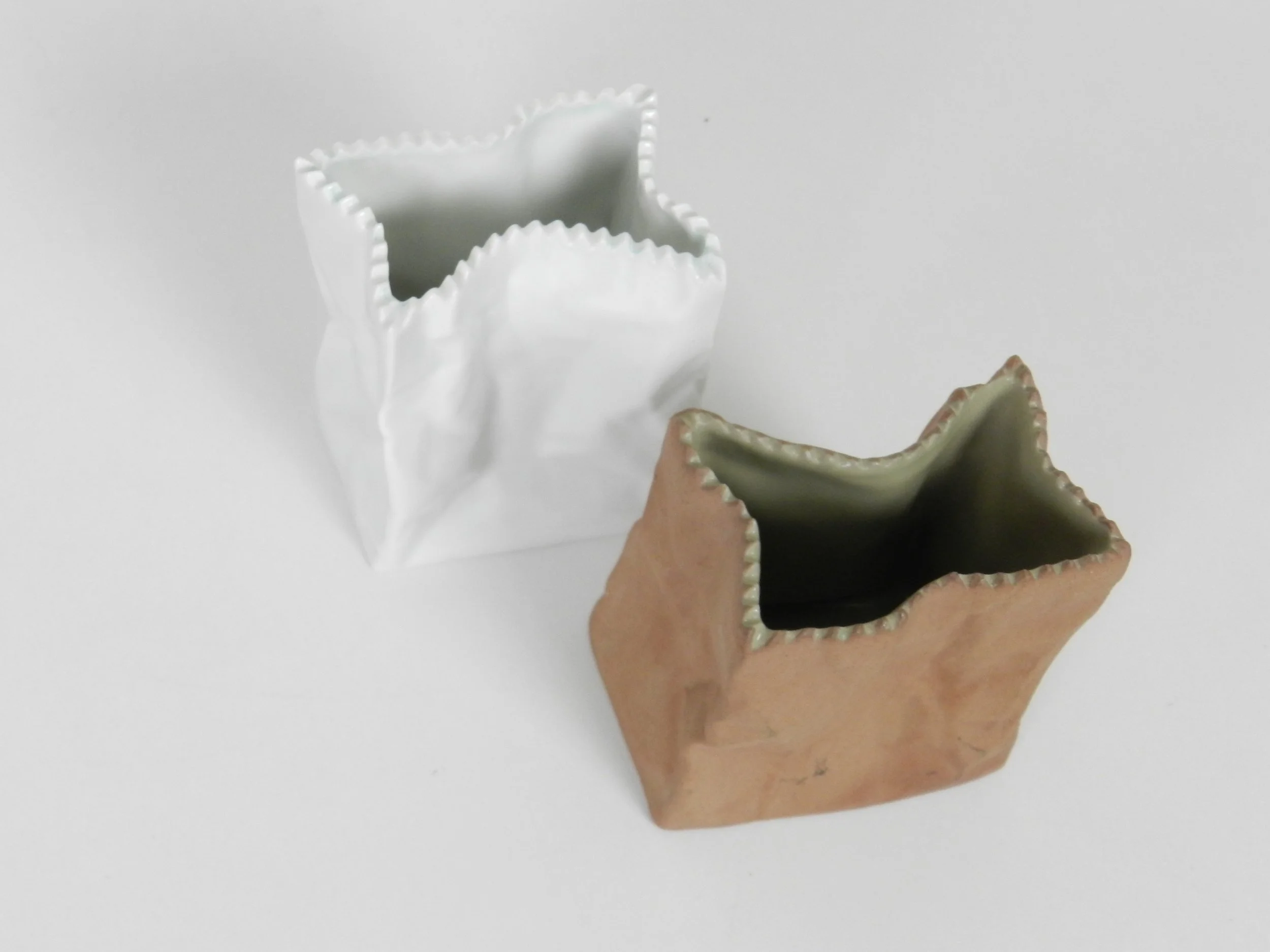 Small porcelain paper bag vases designed by Tapio Wirkkala for Rosenthal.  Germany, 1970s.