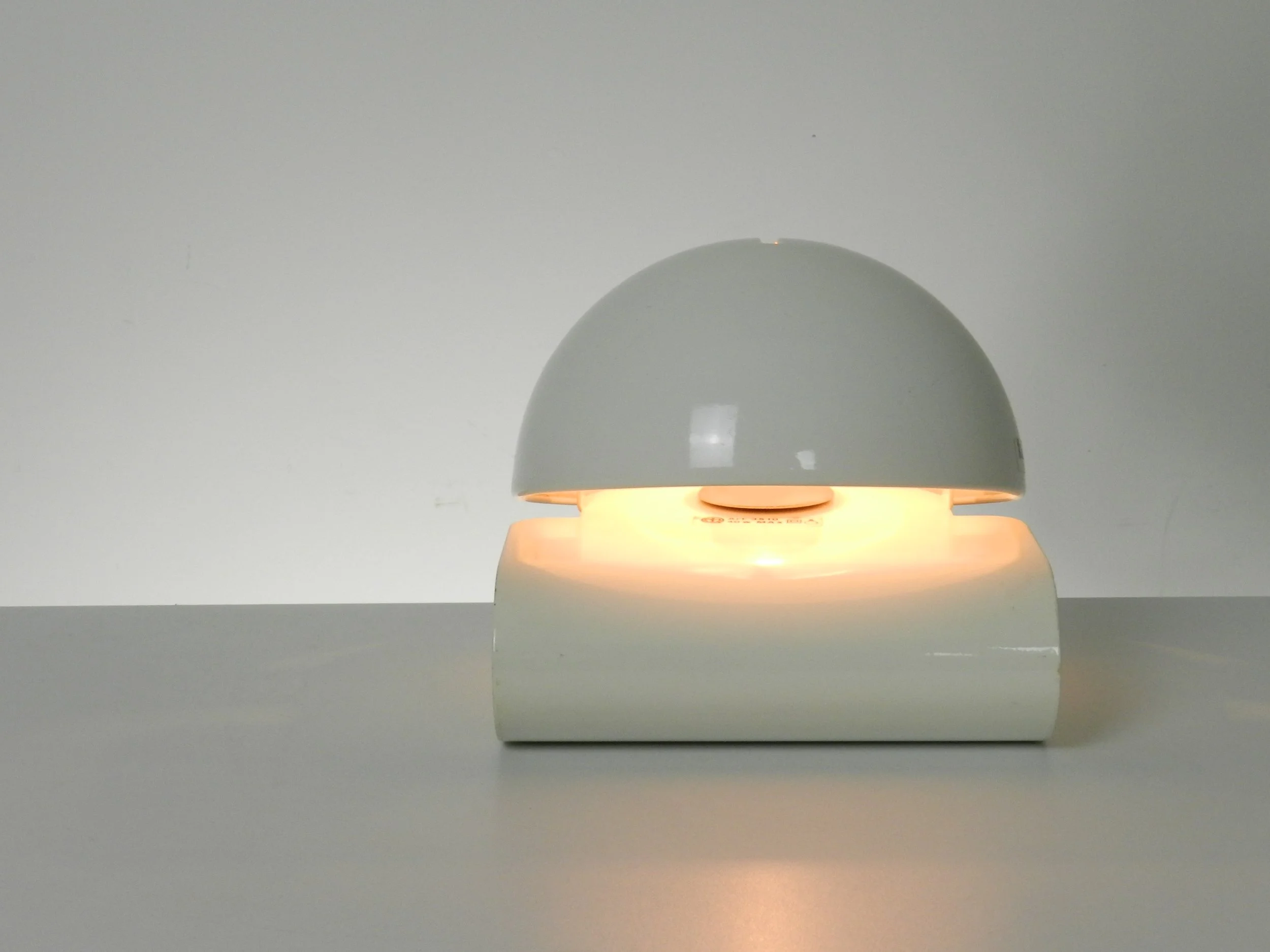 Space age Bugia lamp designed by Giuseppe Cormio for Guzzini.  In enameled metal with adjustable visors.  Italy, 1970s.