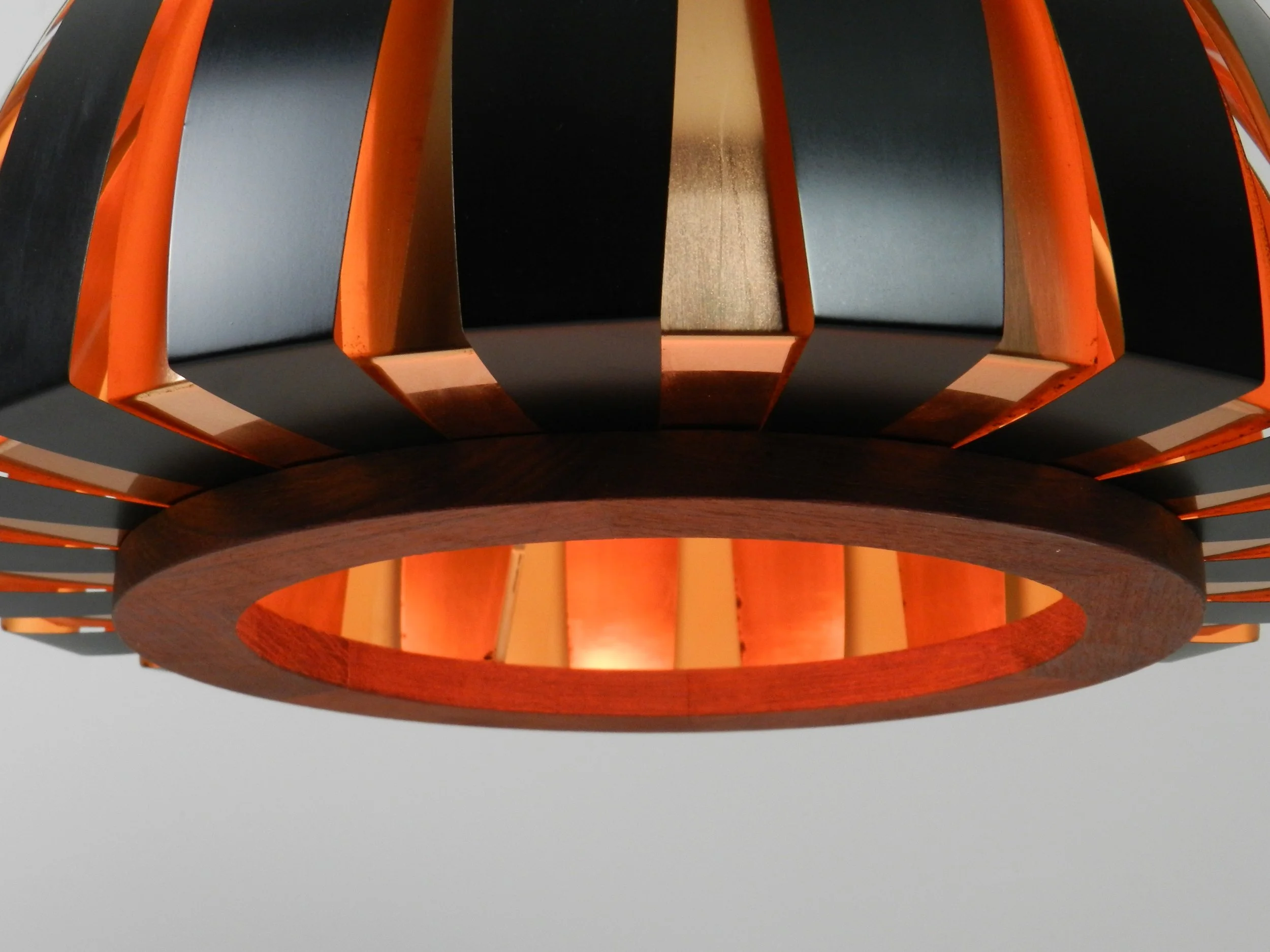 Fiesta pendant lamp designed by Svend Aage Holm Sorensen. Copper, enameled metal and teak.  Denmark, 1960s.