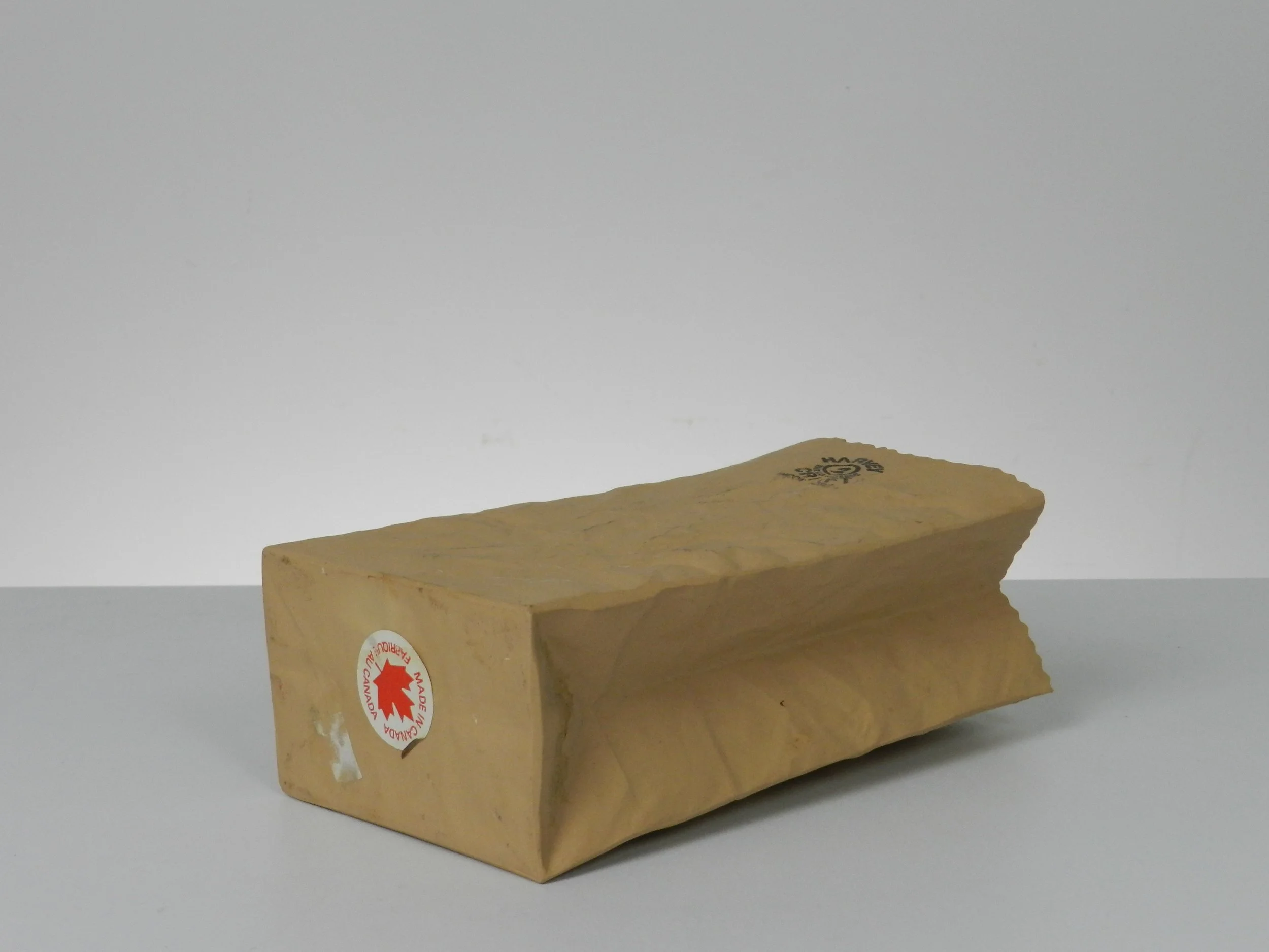 Ceramic paper bag vase designed by Michael Harvey.  Canada, 1980s.