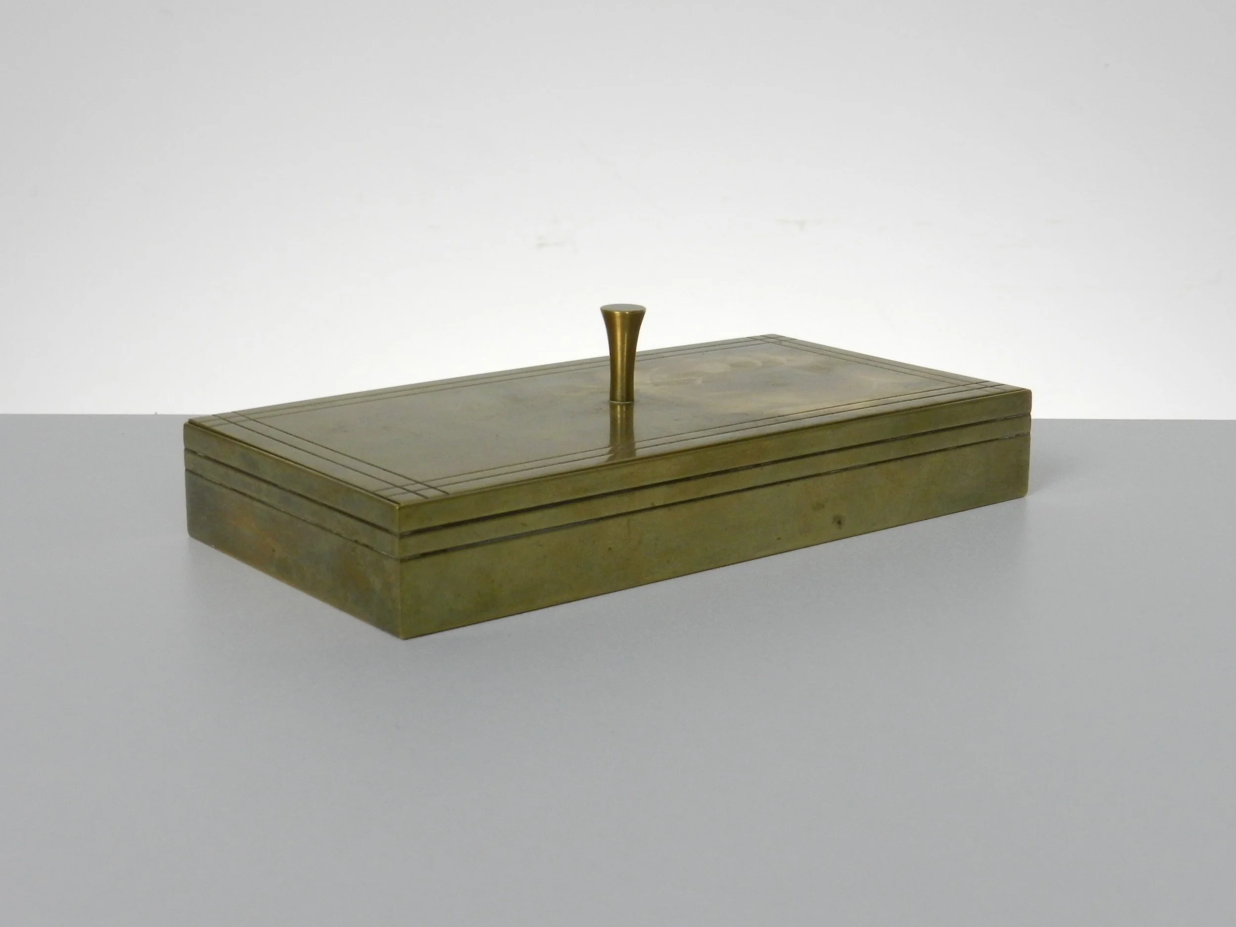 Small brass jewelry box with wood interior designed by Tommi Parzinger for Dorlyn Silversmiths.  USA, 1950s.