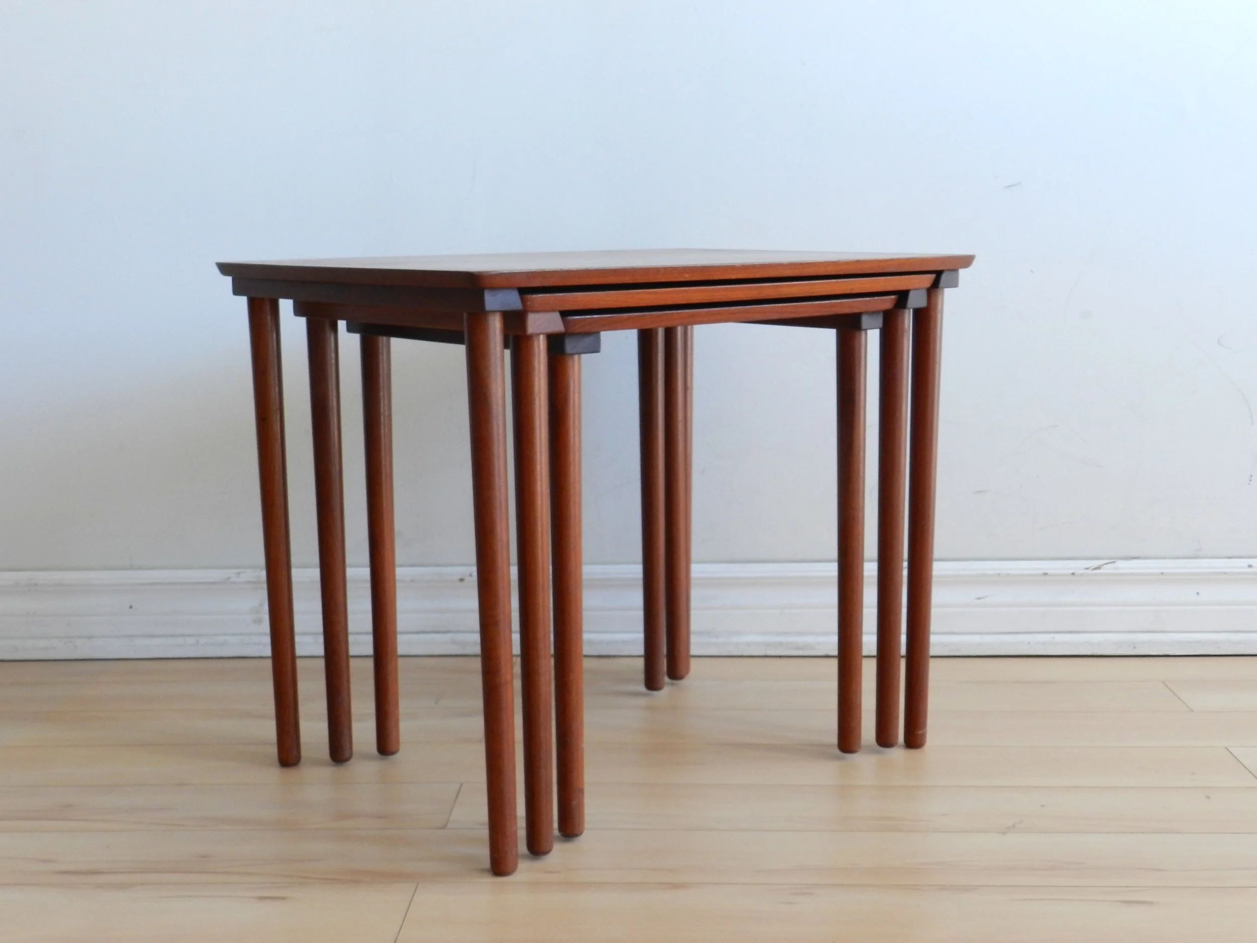 Set of three teak nesting tables by Mobelintarsia.  Denmark, 1960s.